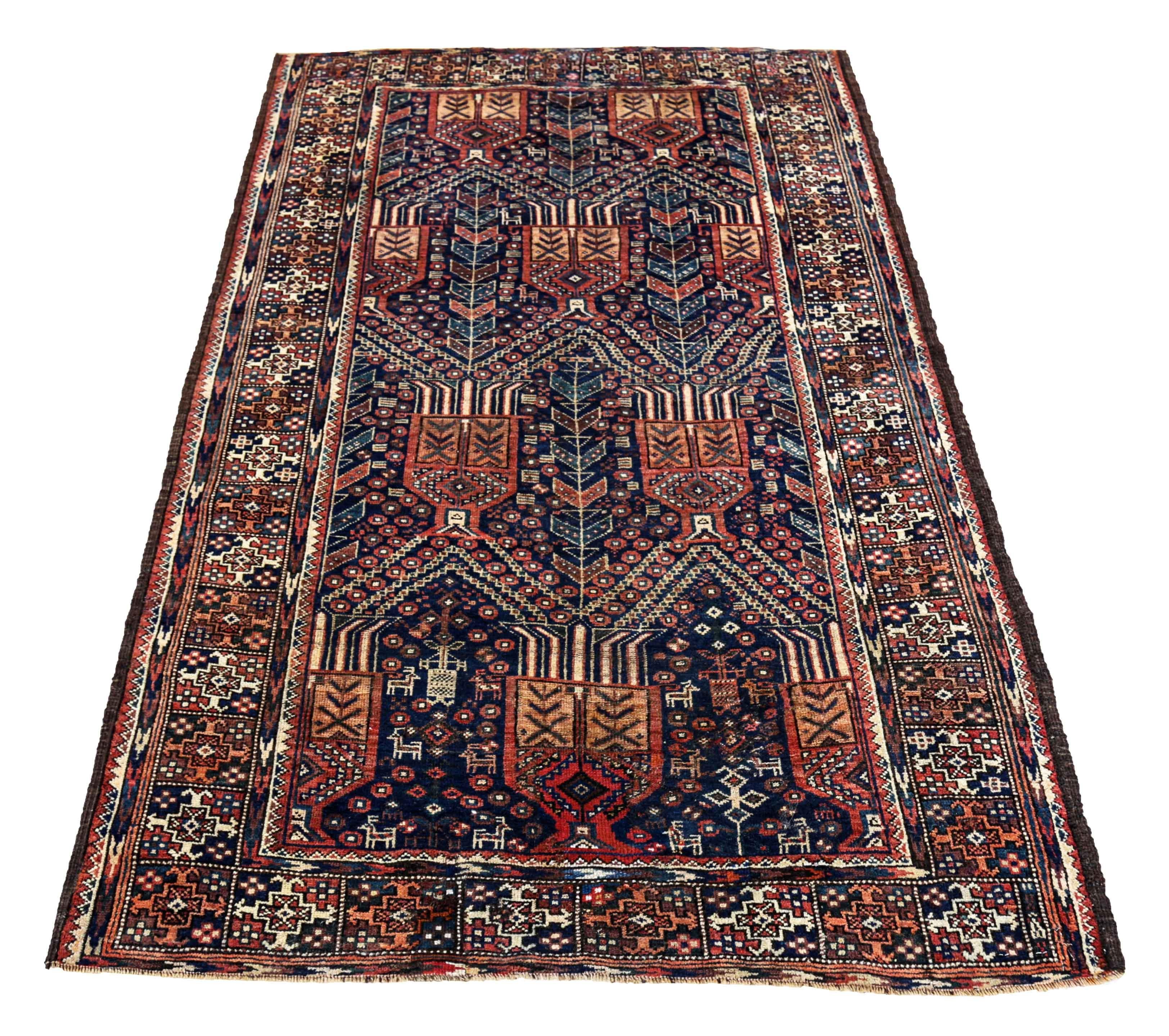Antique Persian area rug handwoven from the finest sheep’s wool. It’s colored with all-natural vegetable dyes that are safe for humans and pets. It’s a traditional Balouch design handwoven by expert artisans. It’s a lovely area rug that can be