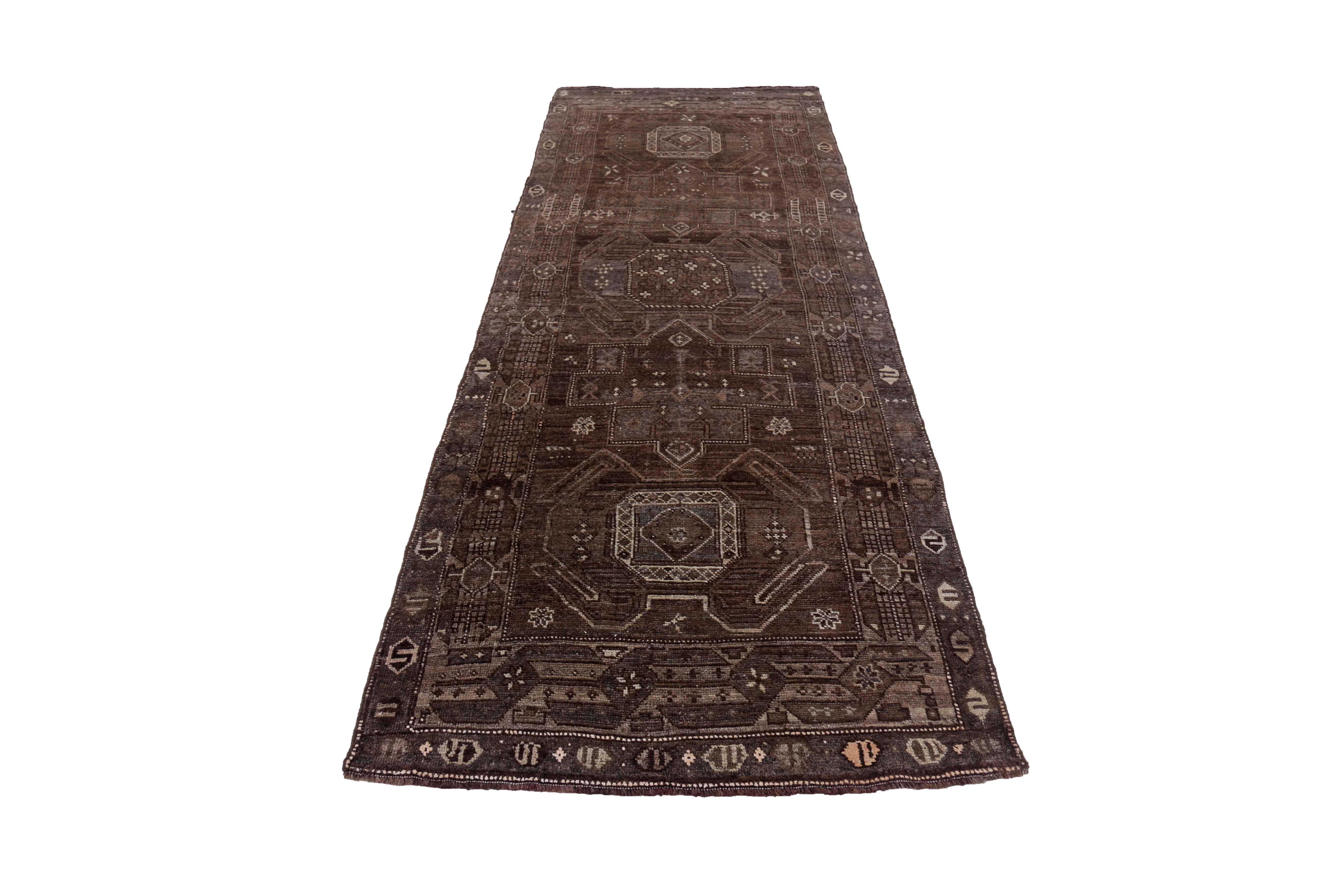 Antique Persian area rug handwoven from the finest sheep’s wool. It’s colored with all-natural vegetable dyes that are safe for humans and pets. It’s a traditional Bijar design handwoven by expert artisans. It’s a lovely area rug that can be