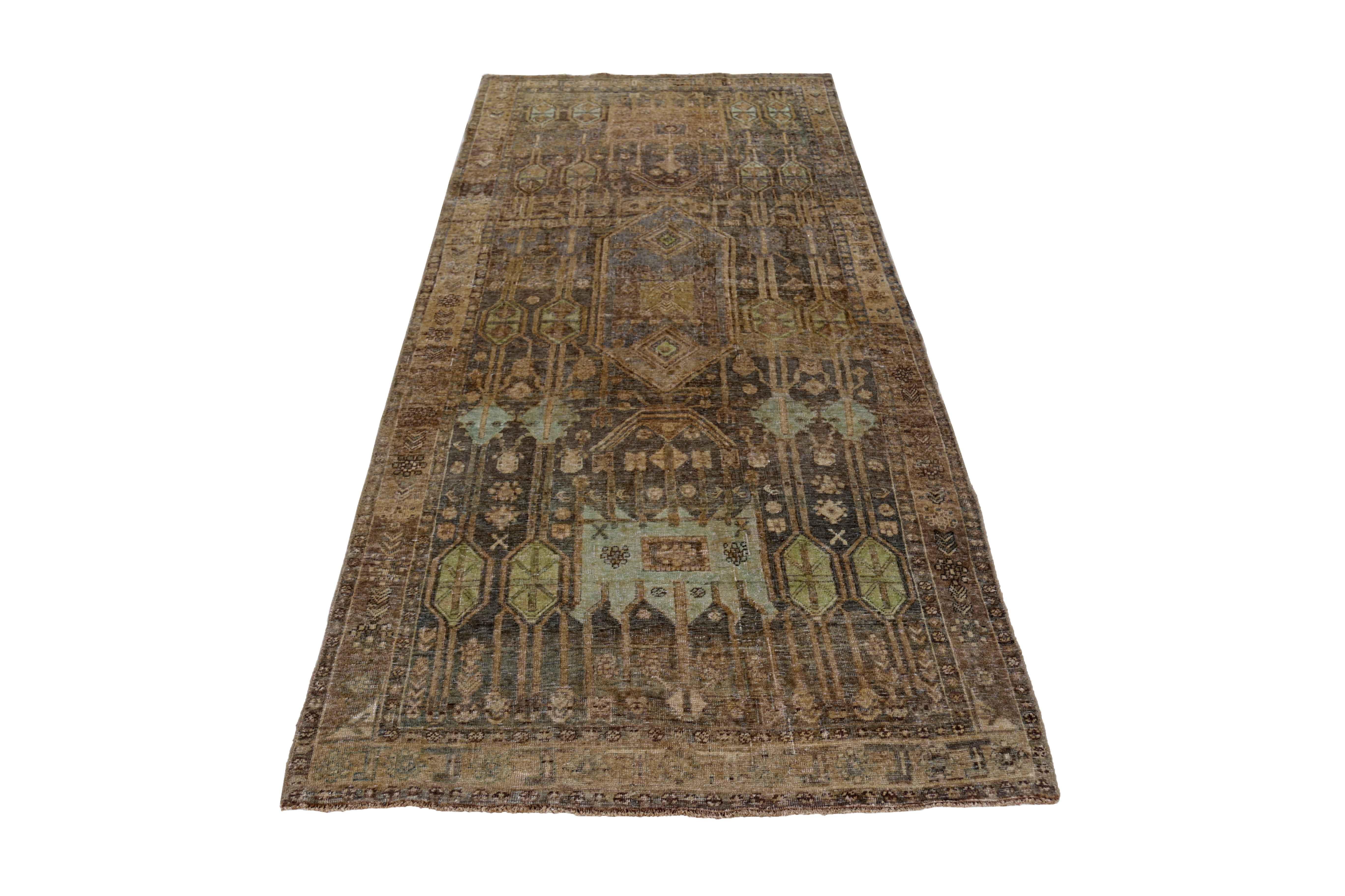 Antique Persian area rug handwoven from the finest sheep’s wool. It’s colored with all-natural vegetable dyes that are safe for humans and pets. It’s a traditional Bijar design handwoven by expert artisans. It’s a lovely area rug that can be