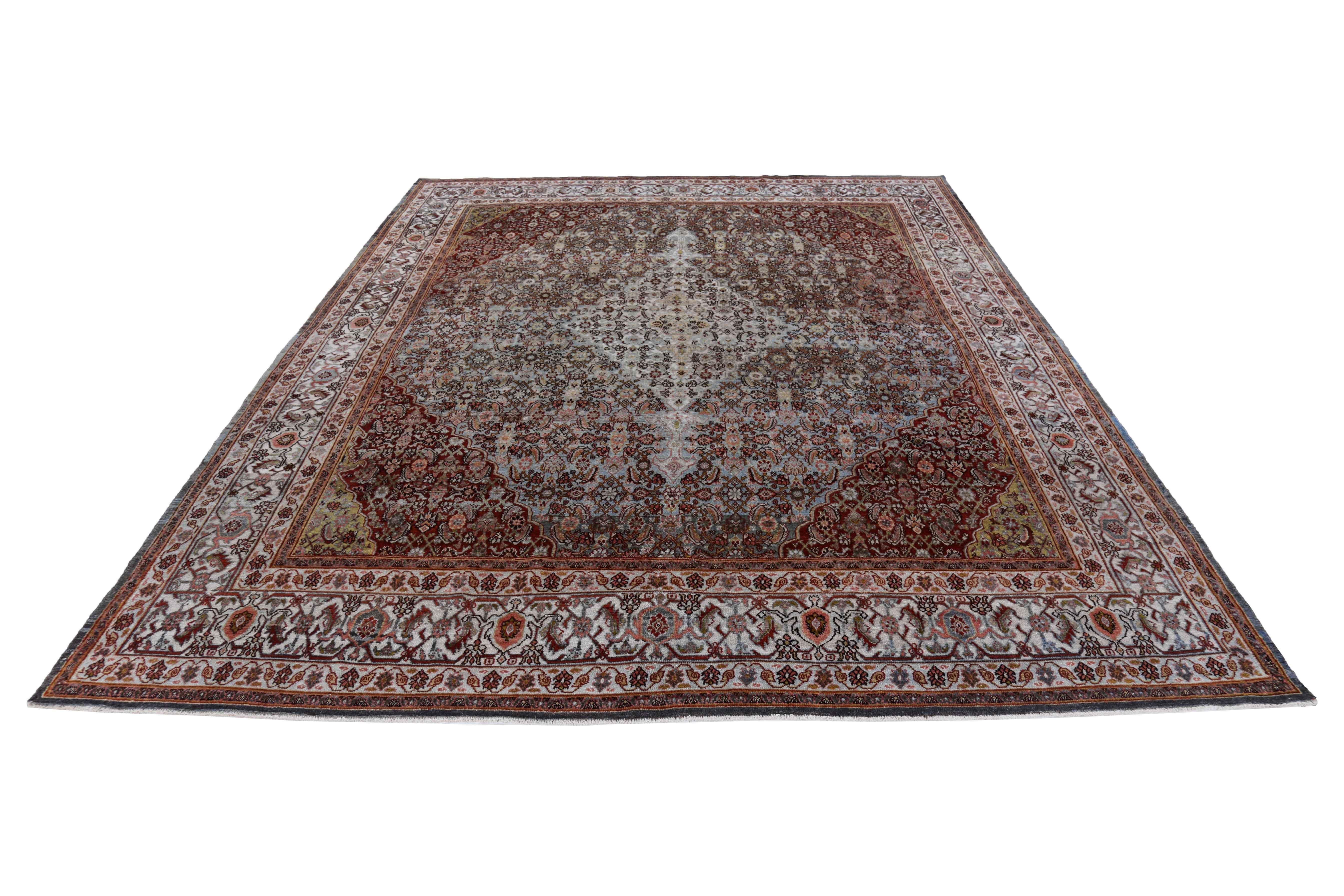 Antique Persian area rug handwoven from the finest sheep’s wool. It’s colored with all-natural vegetable dyes that are safe for humans and pets. It’s a traditional Bijar design handwoven by expert artisans. It’s a lovely area rug that can be