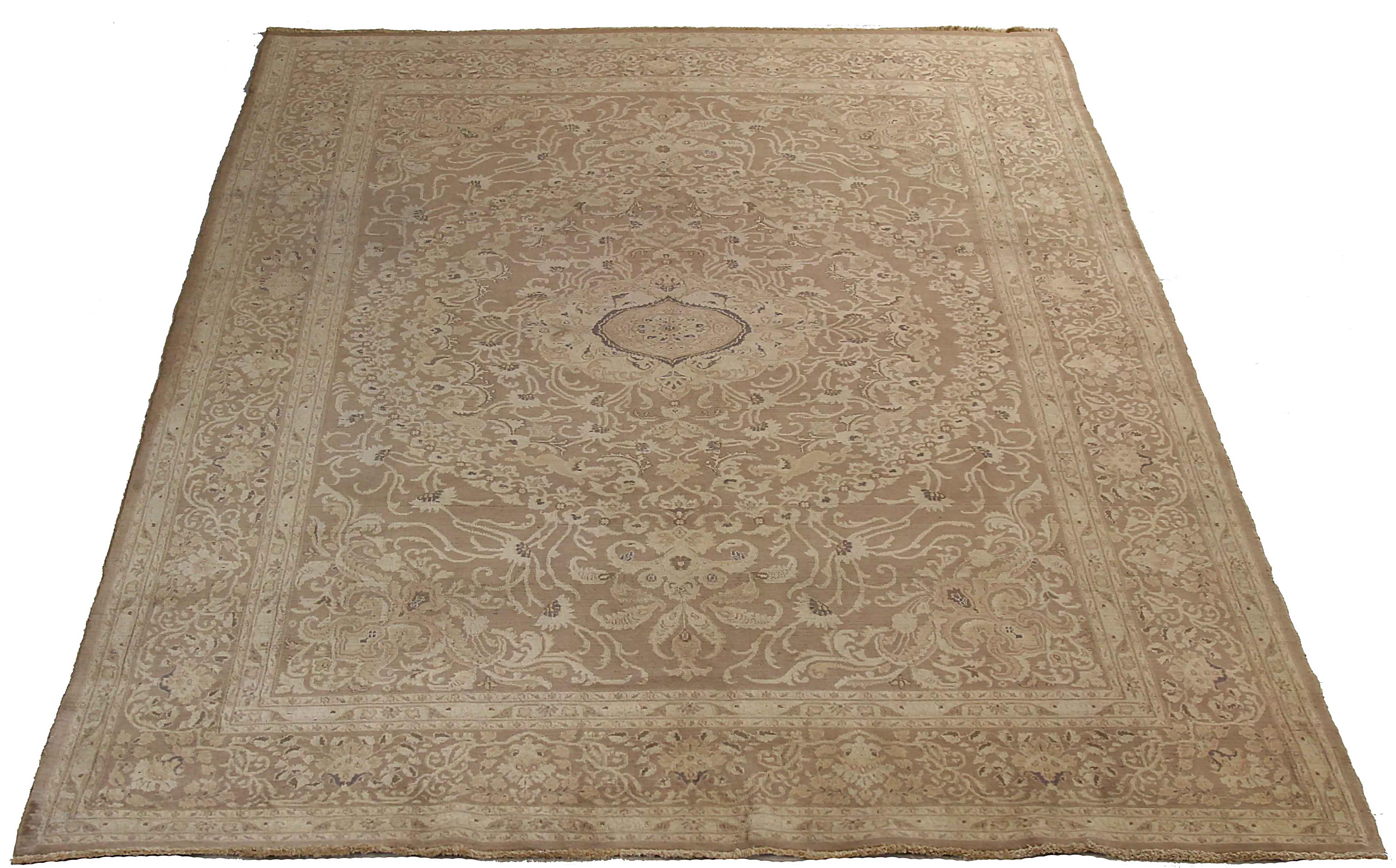 Antique Persian area rug handmade from the highest quality of sheep wool. It’s colored with eco-friendly vegetable dyes that are safe for humans and pets alike. It’s a traditional Dorokhsh design handwoven by expert artisans. It’s a lovely area rug