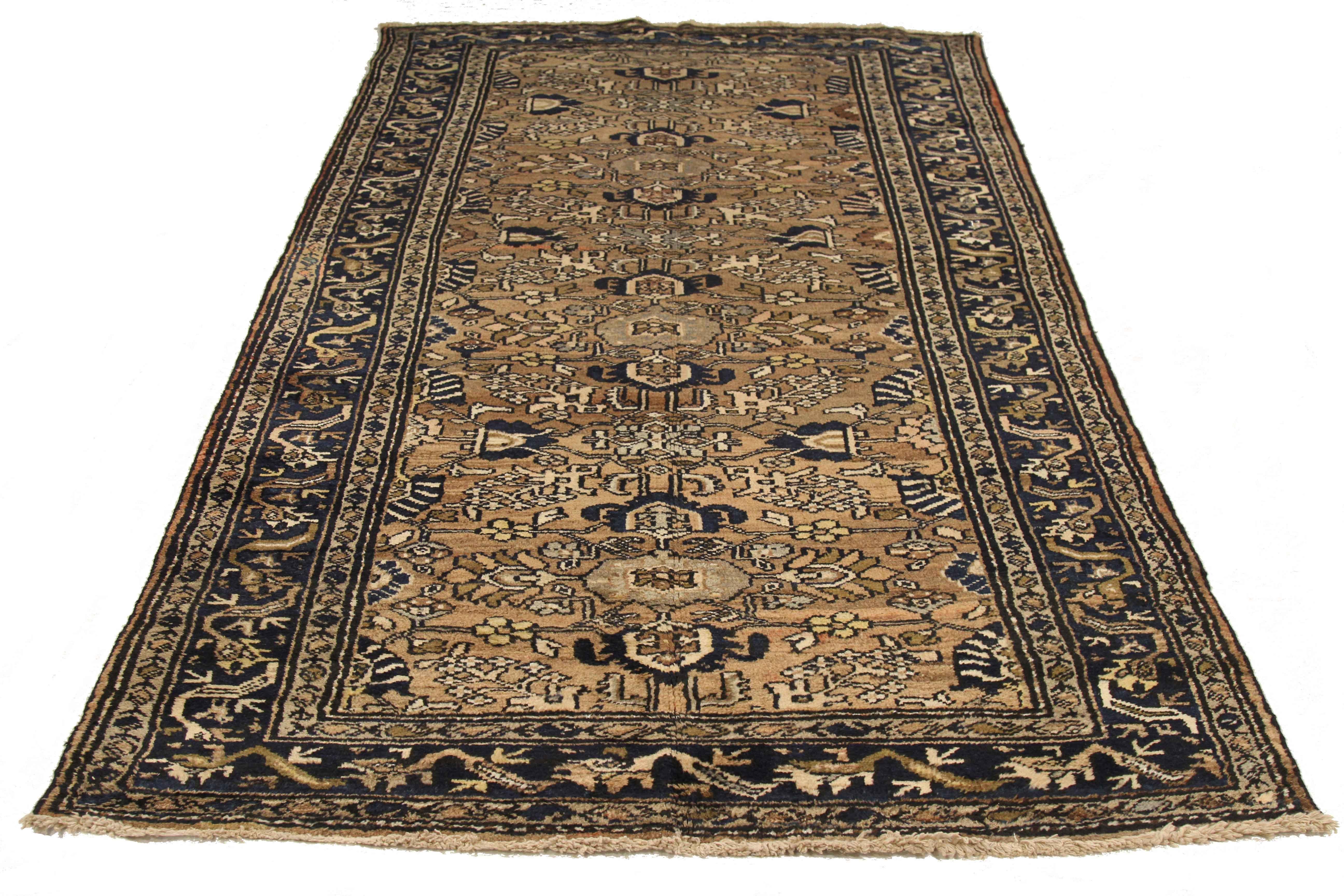 Antique Persian area rug handwoven from the finest sheep’s wool. It’s colored with all-natural vegetable dyes that are safe for humans and pets. It’s a traditional Hamedan design handwoven by expert artisans. It’s a lovely area rug that can be