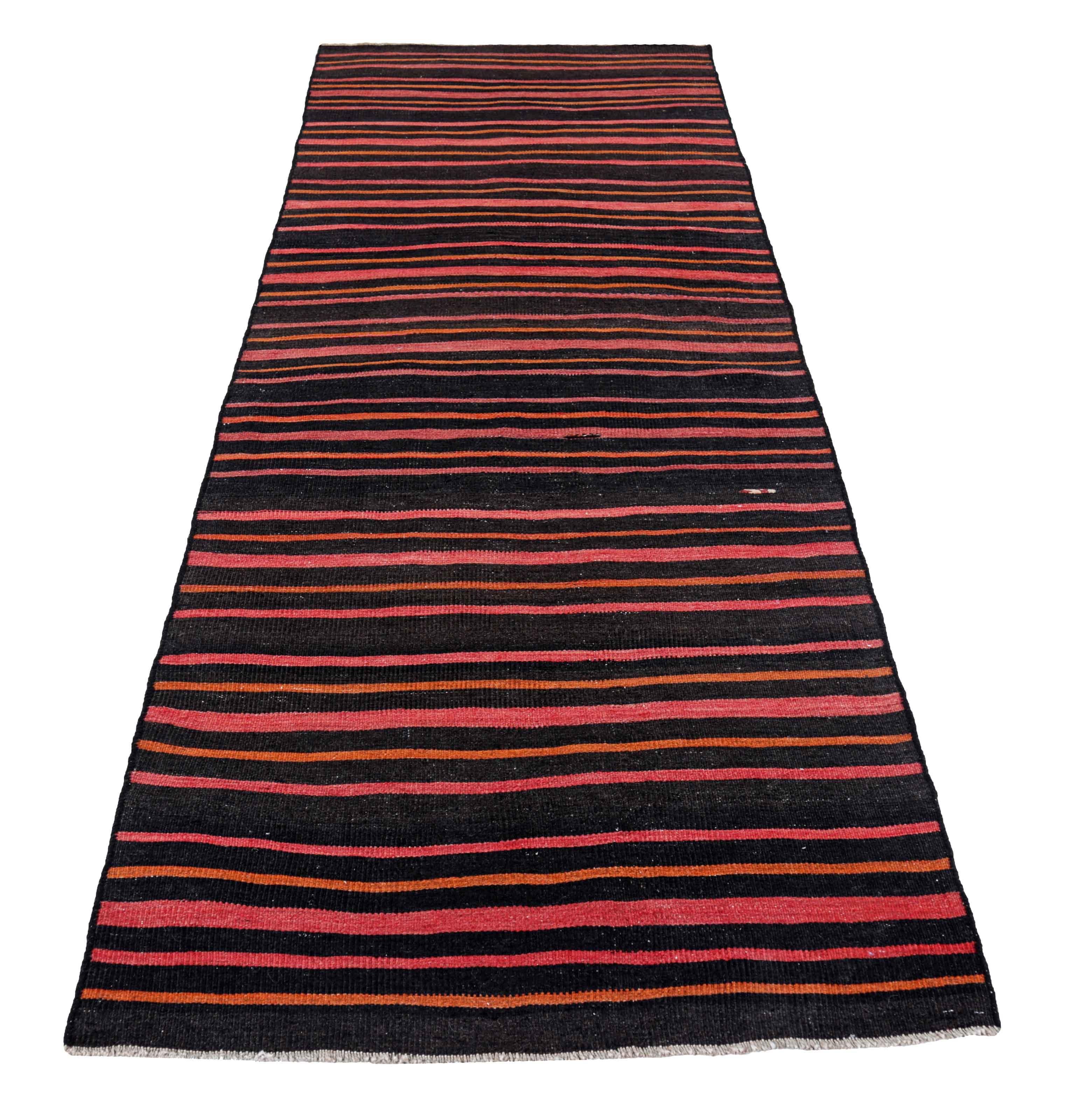 Antique Persian area rug handwoven from the finest sheep’s wool. It’s colored with all-natural vegetable dyes that are safe for humans and pets. It’s a traditional Kilim design handwoven by expert artisans. It’s a lovely area rug that can be