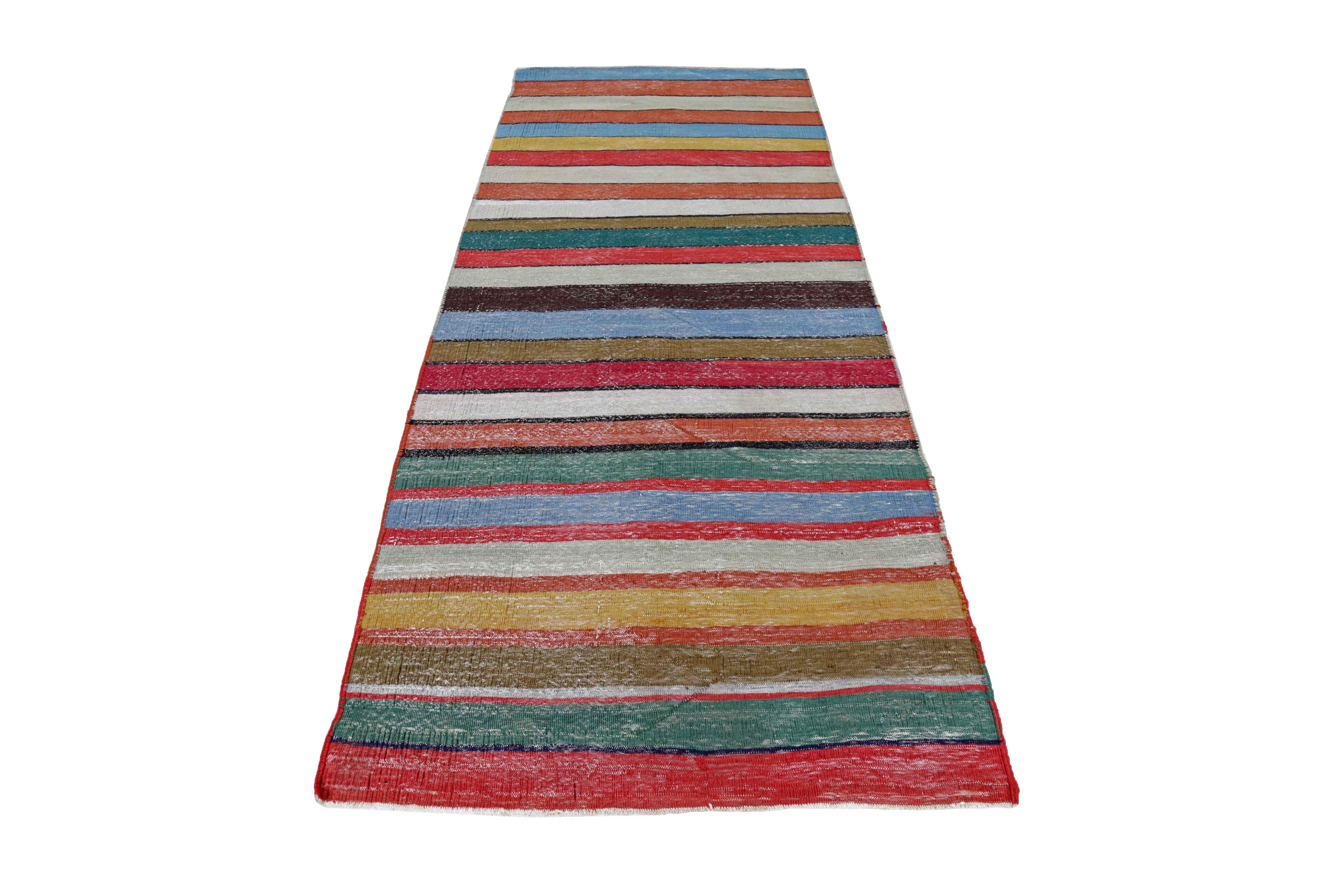 Antique Persian area rug handwoven from the finest sheep’s wool. It’s colored with all-natural vegetable dyes that are safe for humans and pets. It’s a traditional Kilim design handwoven by expert artisans. It’s a lovely area rug that can be