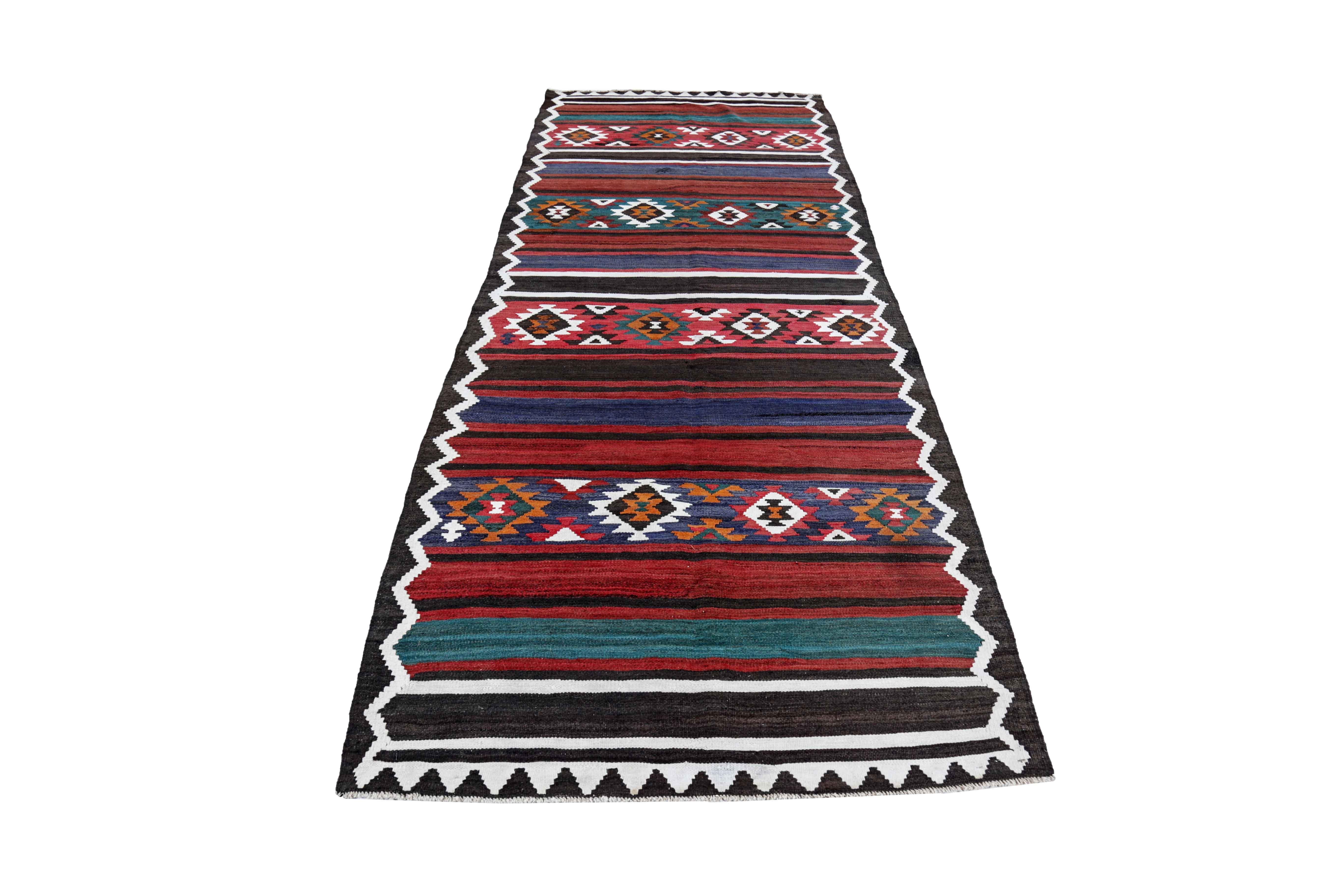 Antique Persian area rug handwoven from the finest sheep’s wool. It’s colored with all-natural vegetable dyes that are safe for humans and pets. It’s a traditional Kilim design handwoven by expert artisans. It’s a lovely area rug that can be