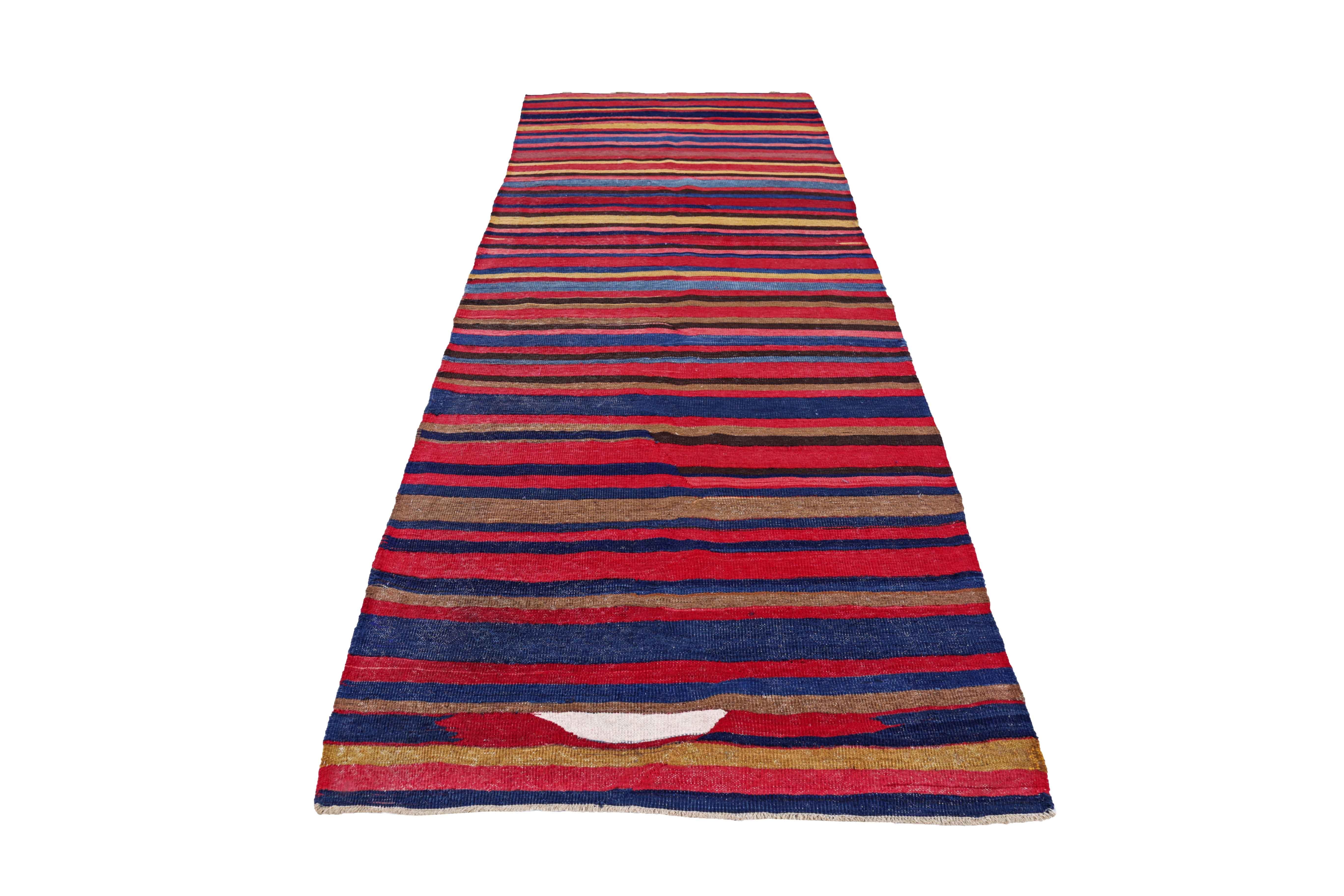 Antique Persian area rug handwoven from the finest sheep’s wool. It’s colored with all-natural vegetable dyes that are safe for humans and pets. It’s a traditional Kilim design handwoven by expert artisans. It’s a lovely area rug that can be