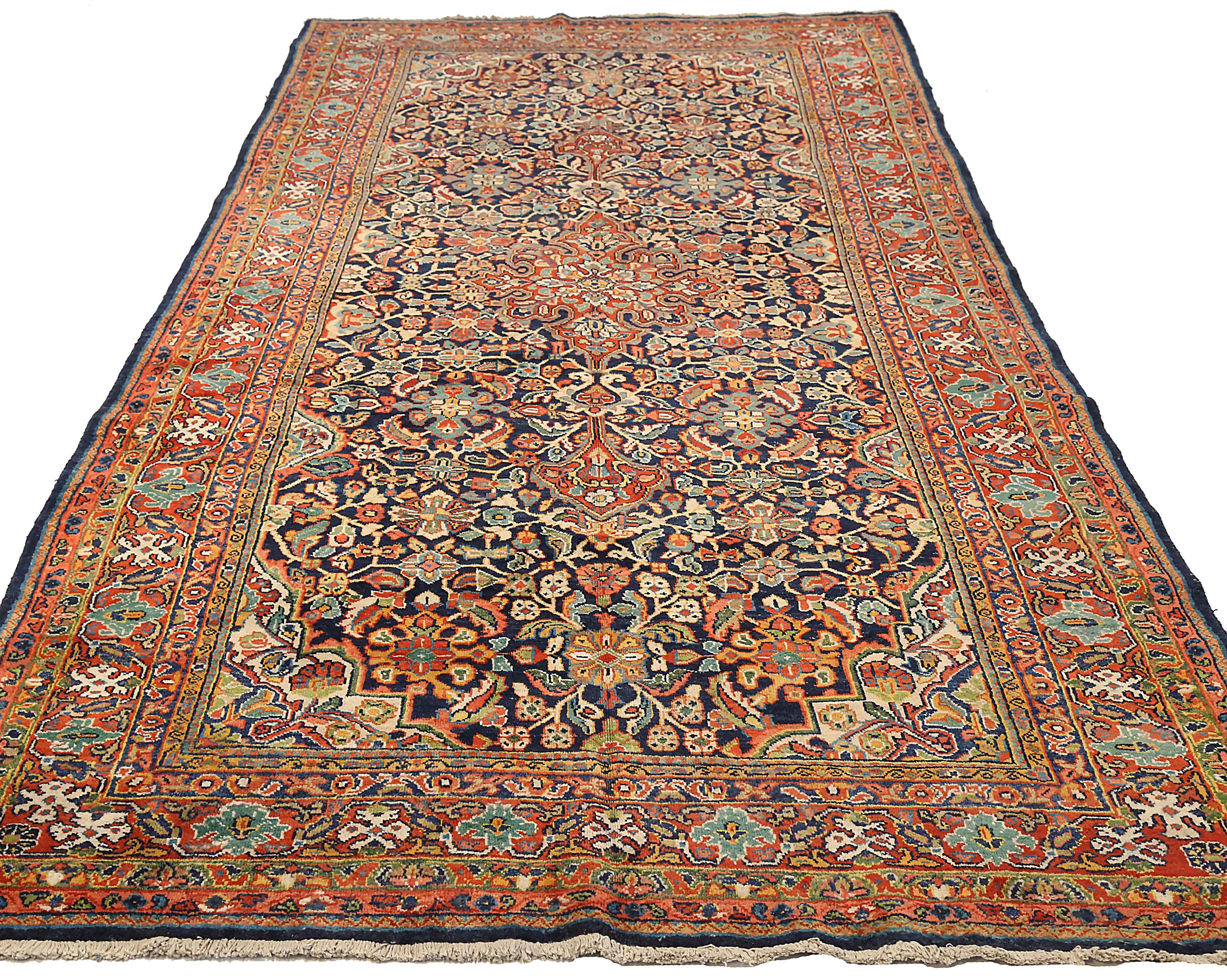 Antique Persian area rug handwoven from the finest sheep’s wool. It’s colored with all-natural vegetable dyes that are safe for humans and pets. It’s a traditional Mahal design handwoven by expert artisans. It’s a lovely area rug that can be