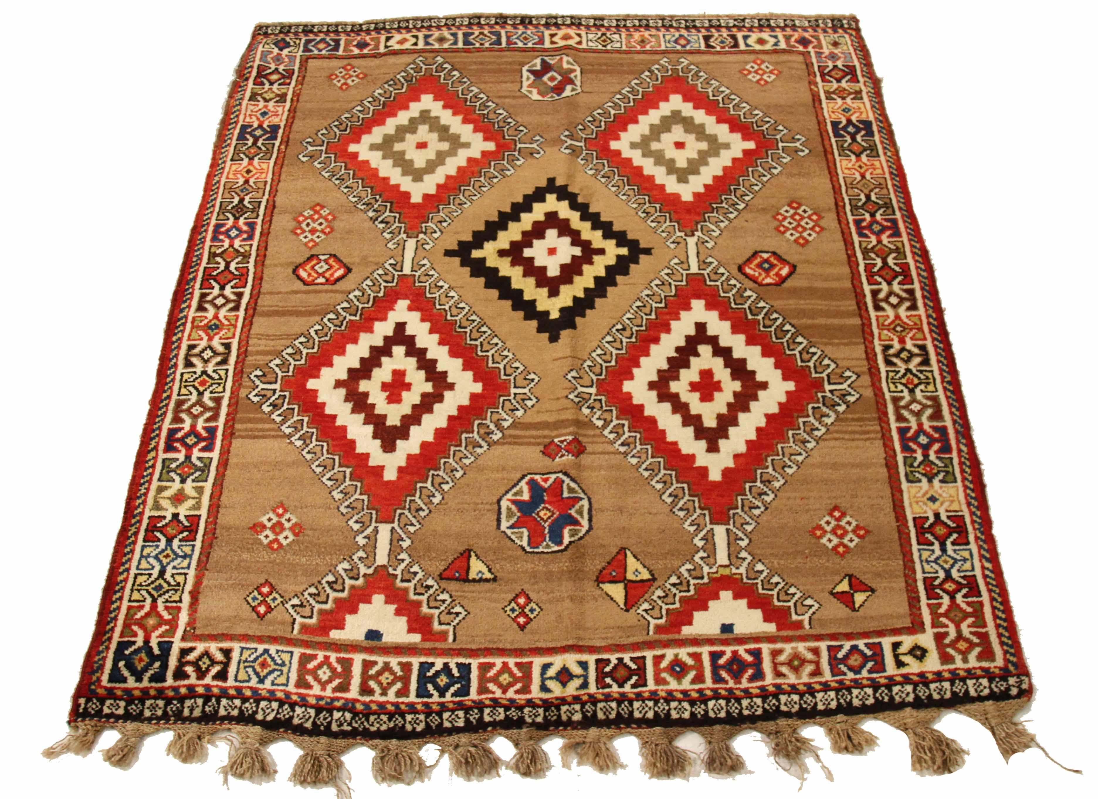 Antique Persian Area Rug, handcrafted from the finest sheep's wool and colored with all-natural vegetable dyes that are safe for humans and pets. The expert artisans have woven it in a traditional Shiraz design, making it a beautiful addition to any