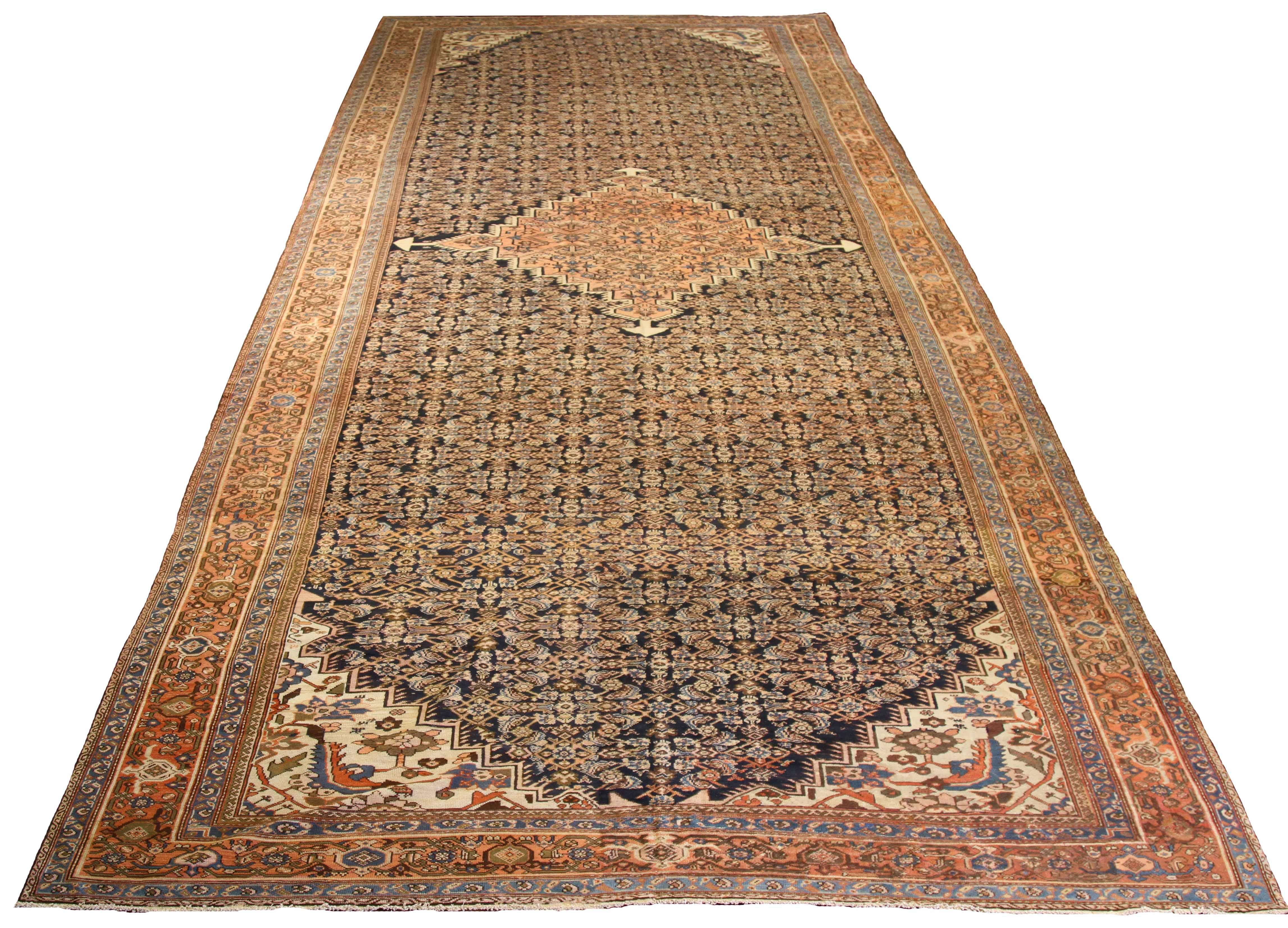 Antique Persian area rug handwoven from the finest sheep’s wool. It’s colored with all-natural vegetable dyes that are safe for humans and pets. It’s a traditional Sultanabad design handwoven by expert artisans. It’s a lovely area rug that can be