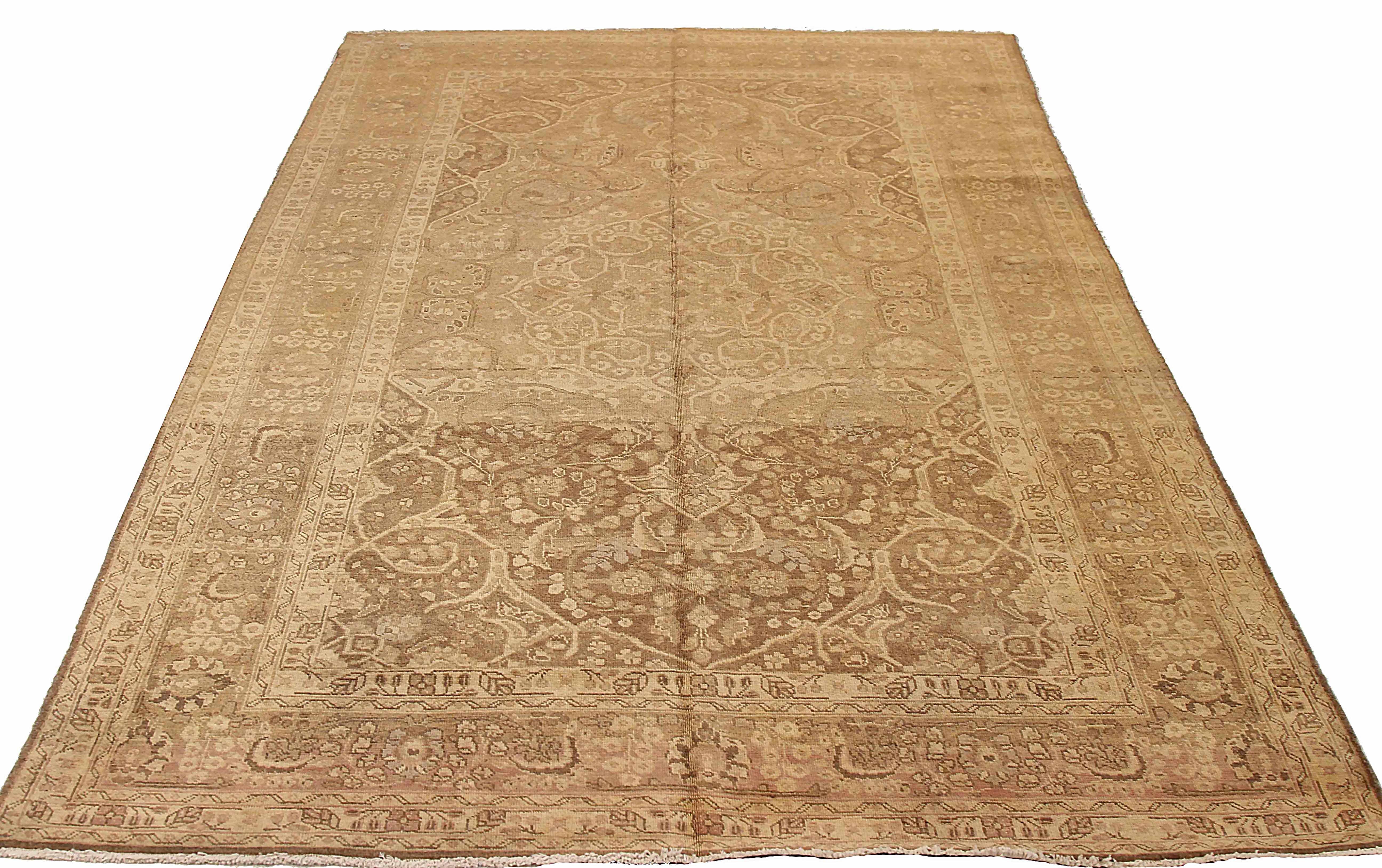 Antique Persian area rug handwoven from the finest sheep’s wool. It’s colored with all-natural vegetable dyes that are safe for humans and pets. It’s a traditional Tabriz design handwoven by expert artisans.It’s a lovely area rug that can be