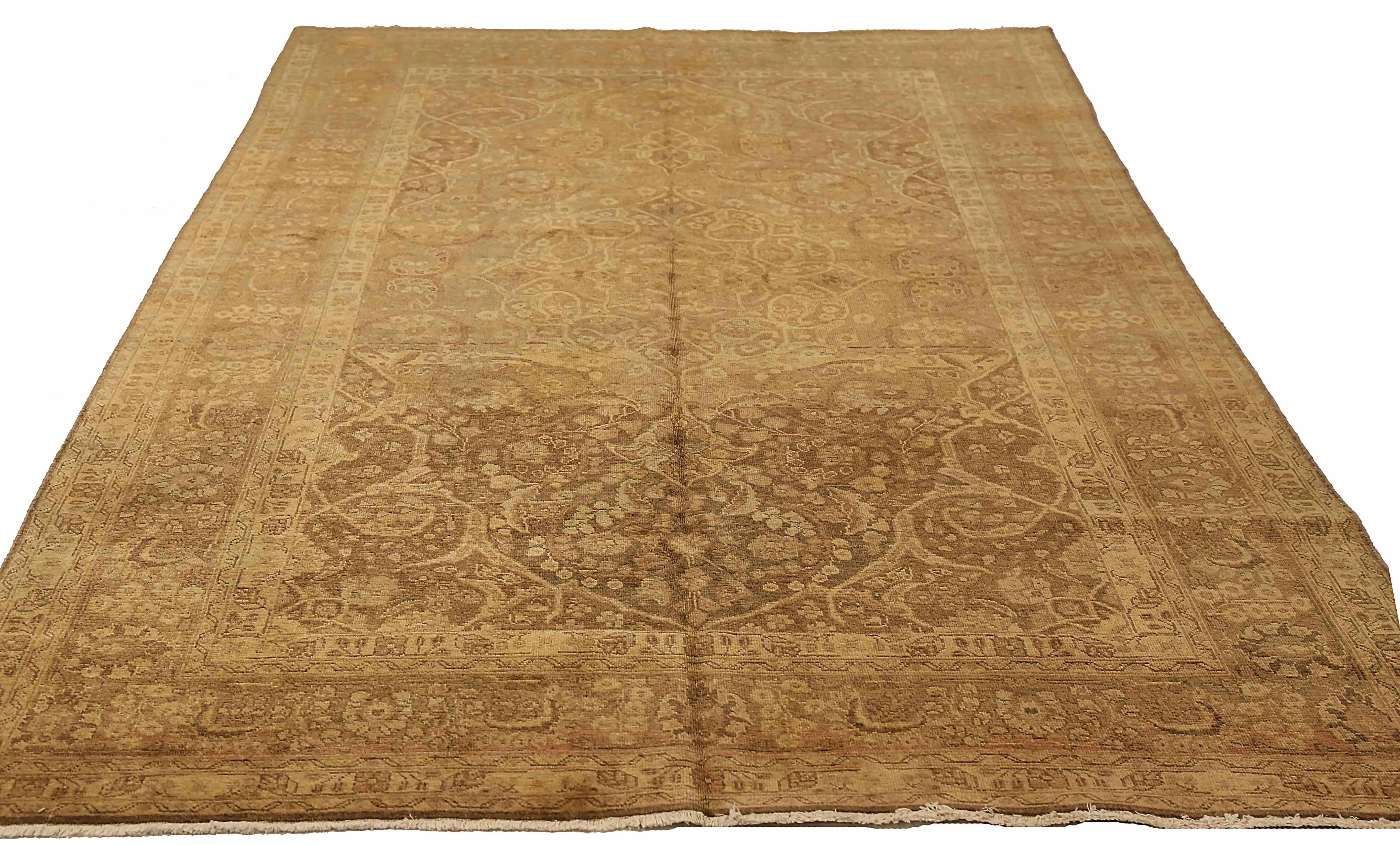 Antique Persian area rug handwoven from the finest sheep’s wool. It’s colored with all-natural vegetable dyes that are safe for humans and pets. It’s a traditional Tabriz design handwoven by expert artisans.It’s a lovely area rug that can be