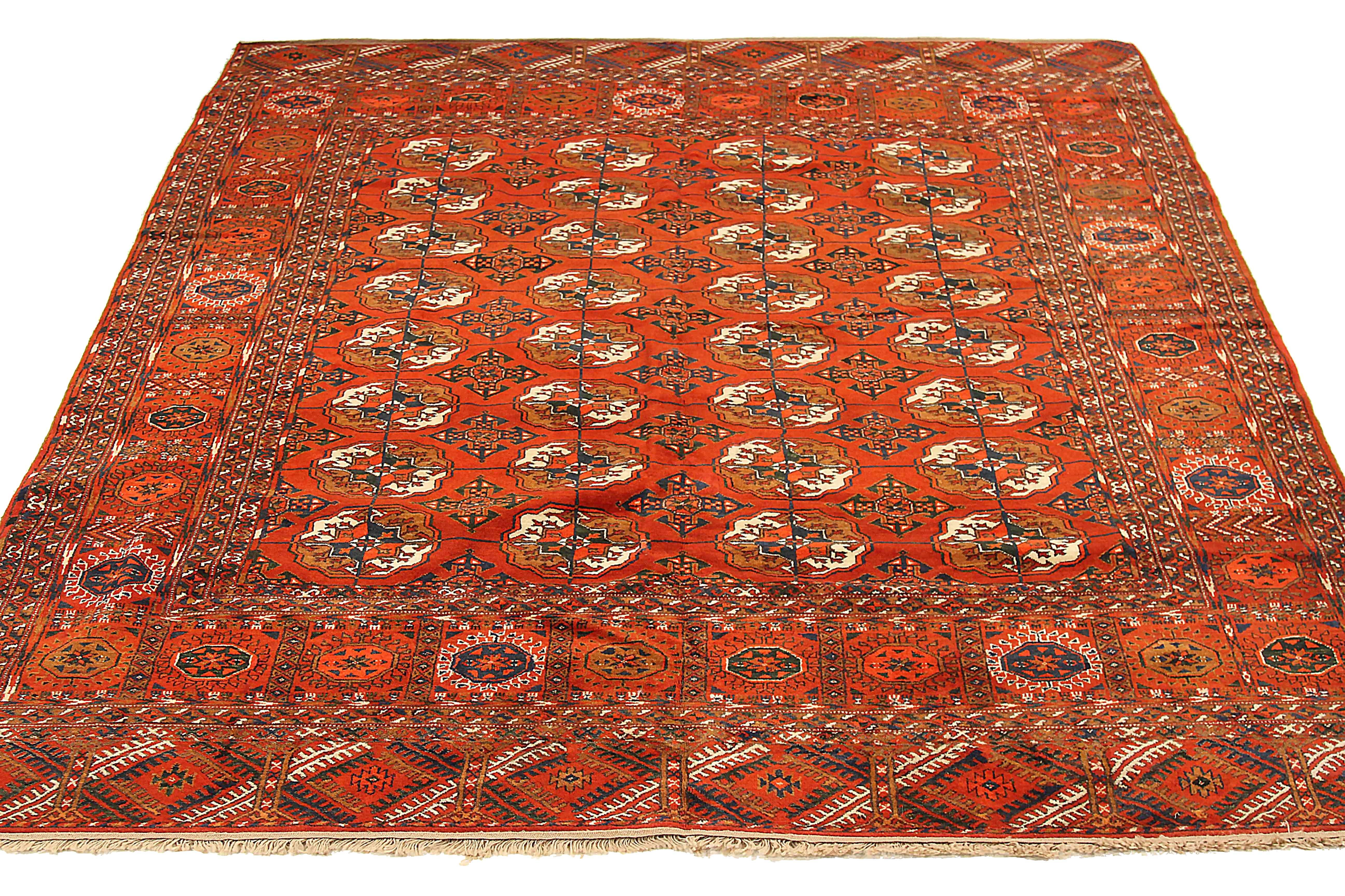 Antique Persian area rug handwoven from the finest sheep’s wool. It’s colored with all-natural vegetable dyes that are safe for humans and pets. It’s a traditional Turkeman design handwoven by expert artisans. It’s a lovely square rug that can be