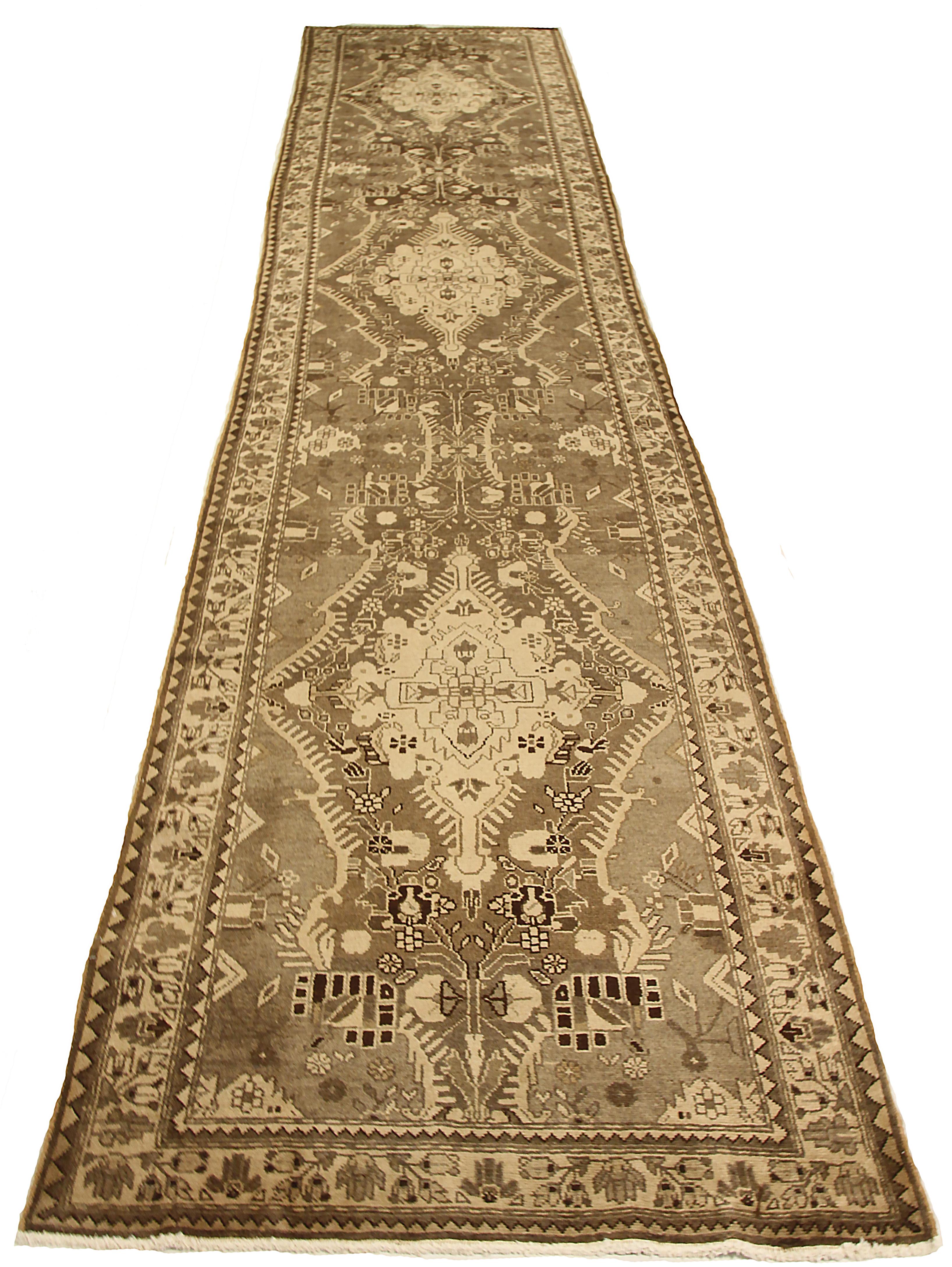 Antique Persian runner rug handwoven from the finest sheep’s wool. It’s colored with all-natural vegetable dyes that are safe for humans and pets. It’s a traditional Azerbaijan design featuring tribal details on a brown field. It’s a lovely piece to