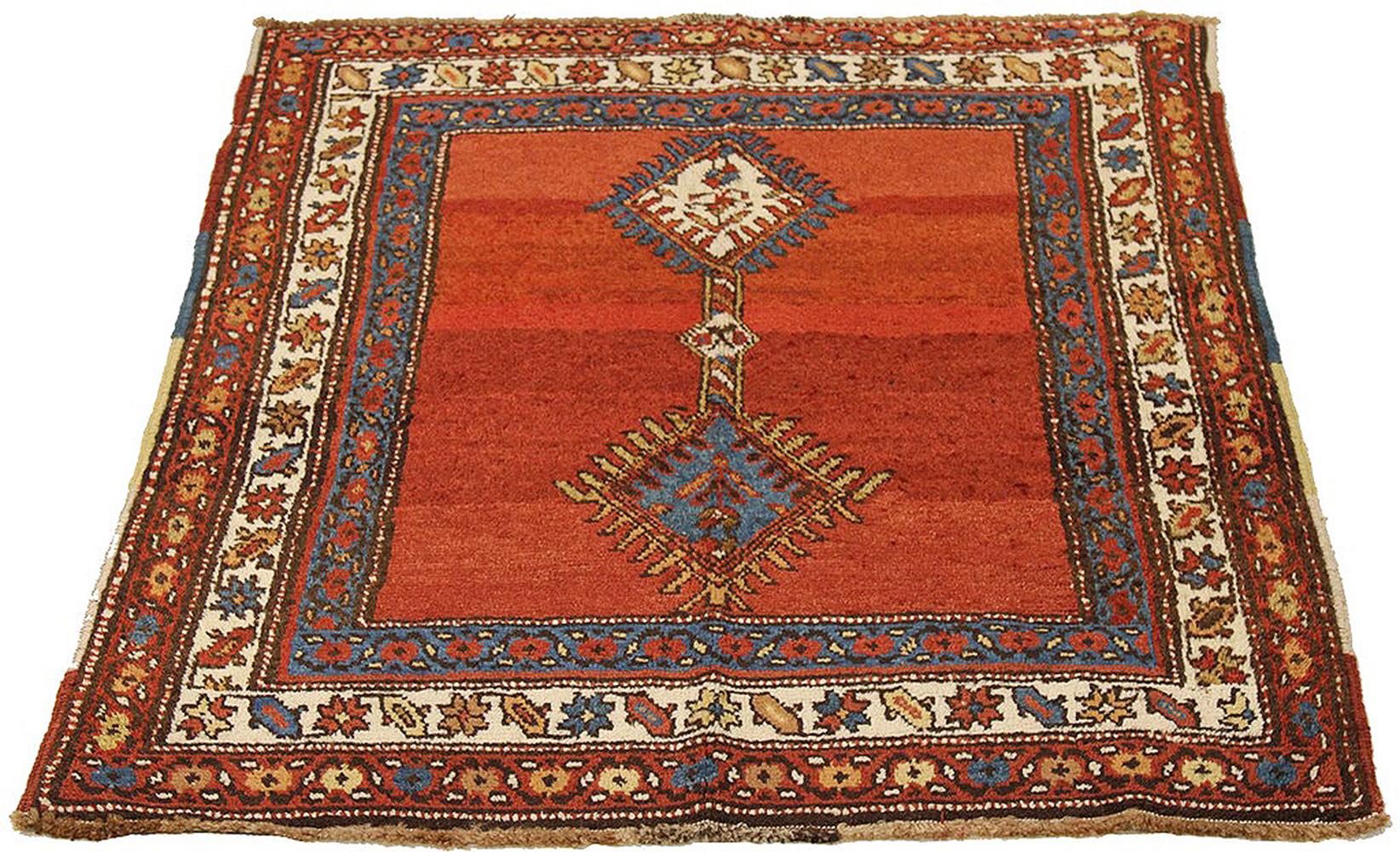 Antique Azerbaijan rug handwoven from the finest sheep’s wool and colored with all-natural vegetable dyes that are safe for humans and pets. It’s a traditional Azerbaijani design featuring floral details in blue and red. It’s a beautiful piece for