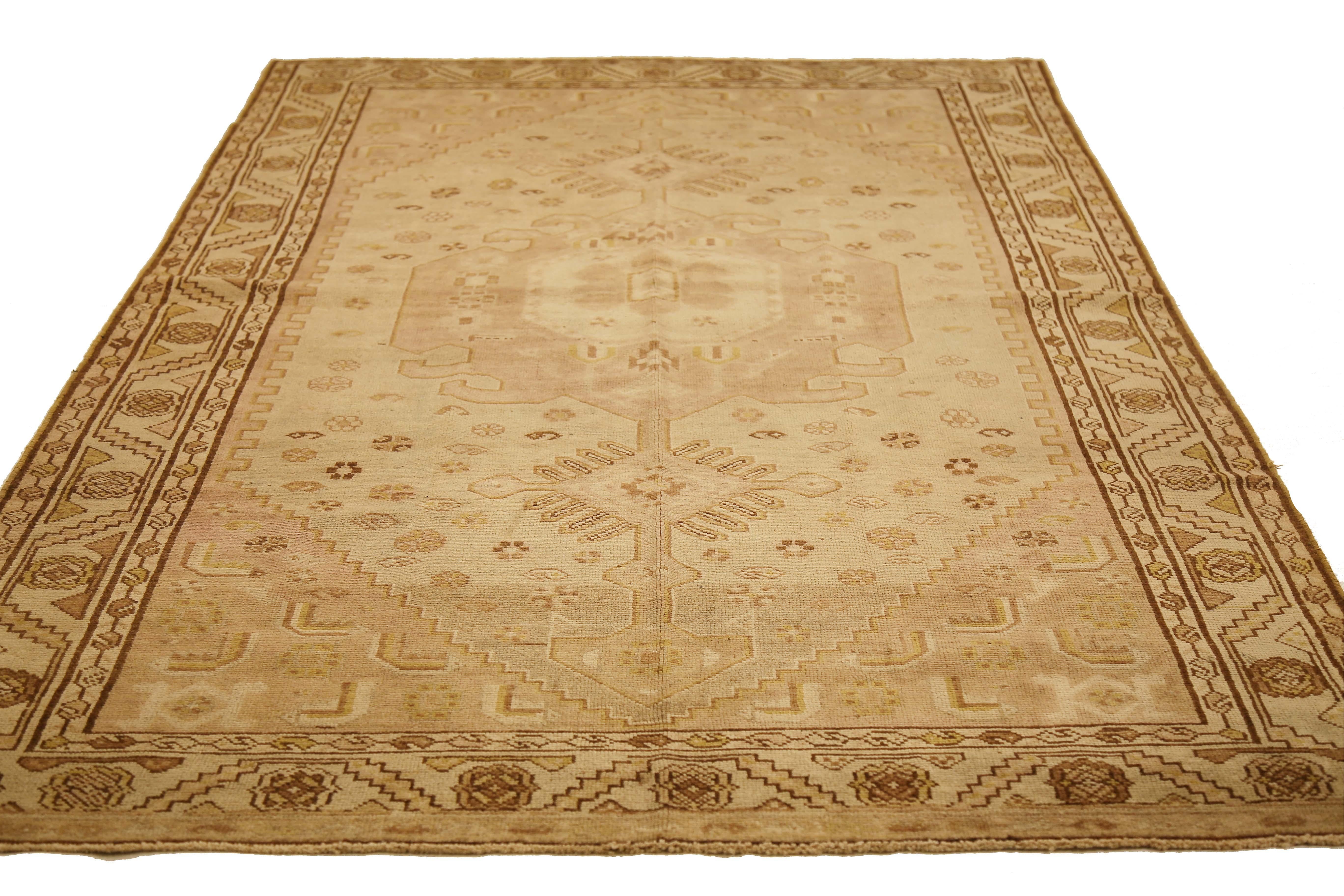 Antique Azerbaijan rug handwoven from the finest sheep’s wool and colored with all-natural vegetable dyes that are safe for humans and pets. It’s a traditional Azerbaijani design featuring mixed floral and geometric details over an ivory field. It