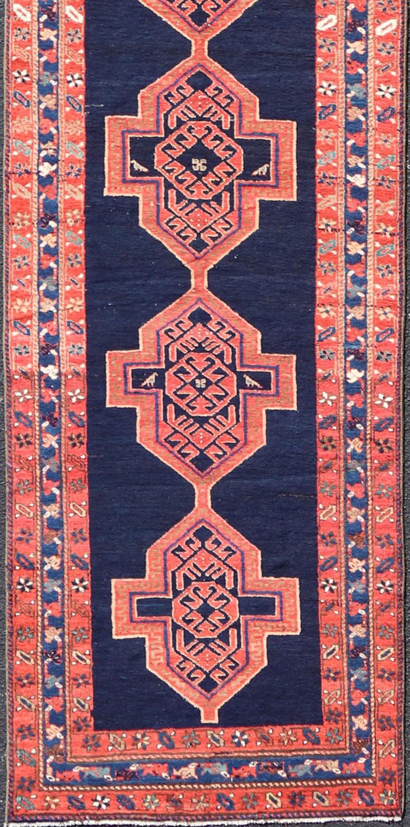 20th Century Antique Persian Azerbaijan Runner in Navy Blue Background with Large Medallions  For Sale