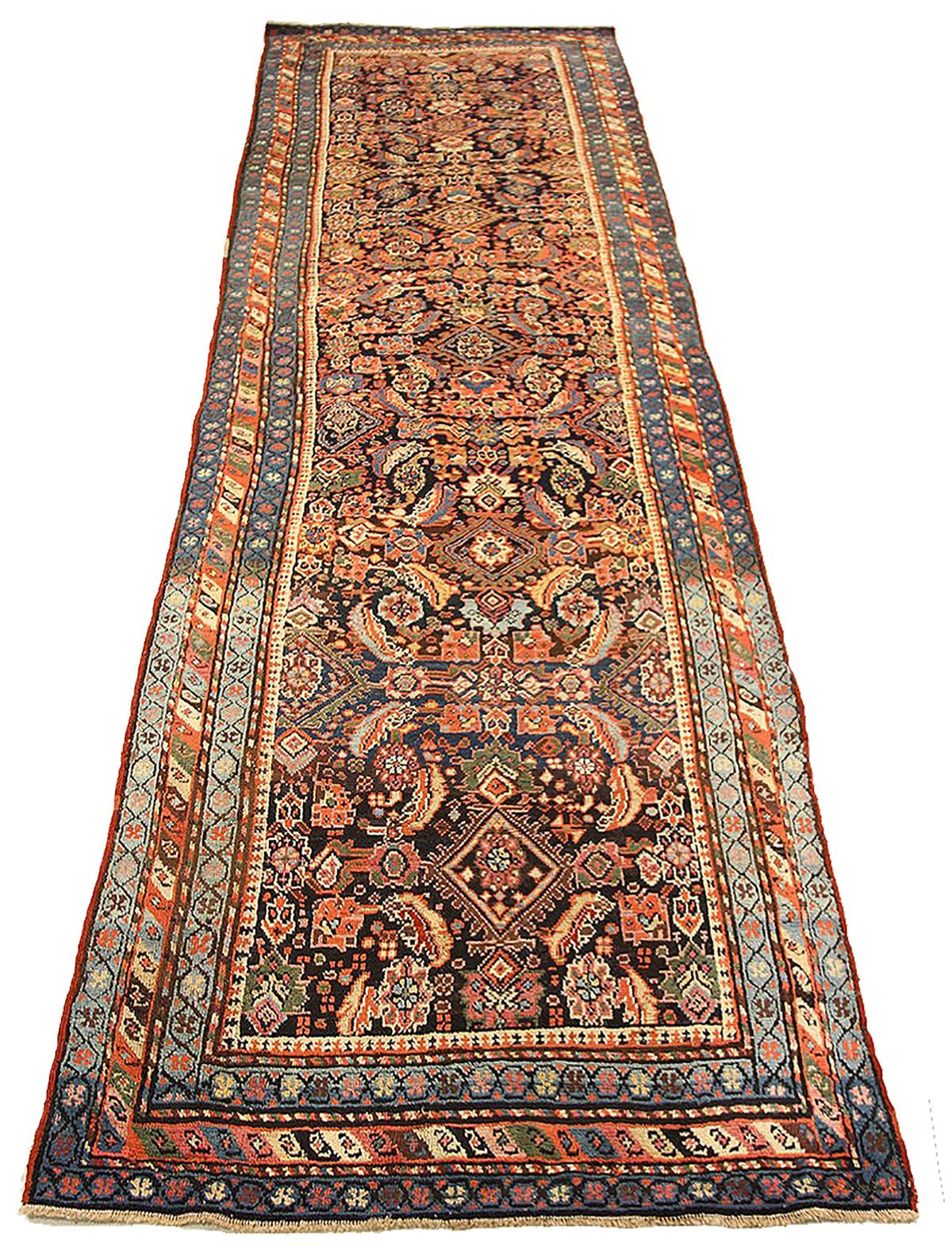 Antique Azerbaijan rug handwoven from the finest sheep’s wool and colored with all-natural vegetable dyes that are safe for humans and pets. It’s a traditional Azerbaijani design featuring mixed floral and geometric details in ivory and blue. It