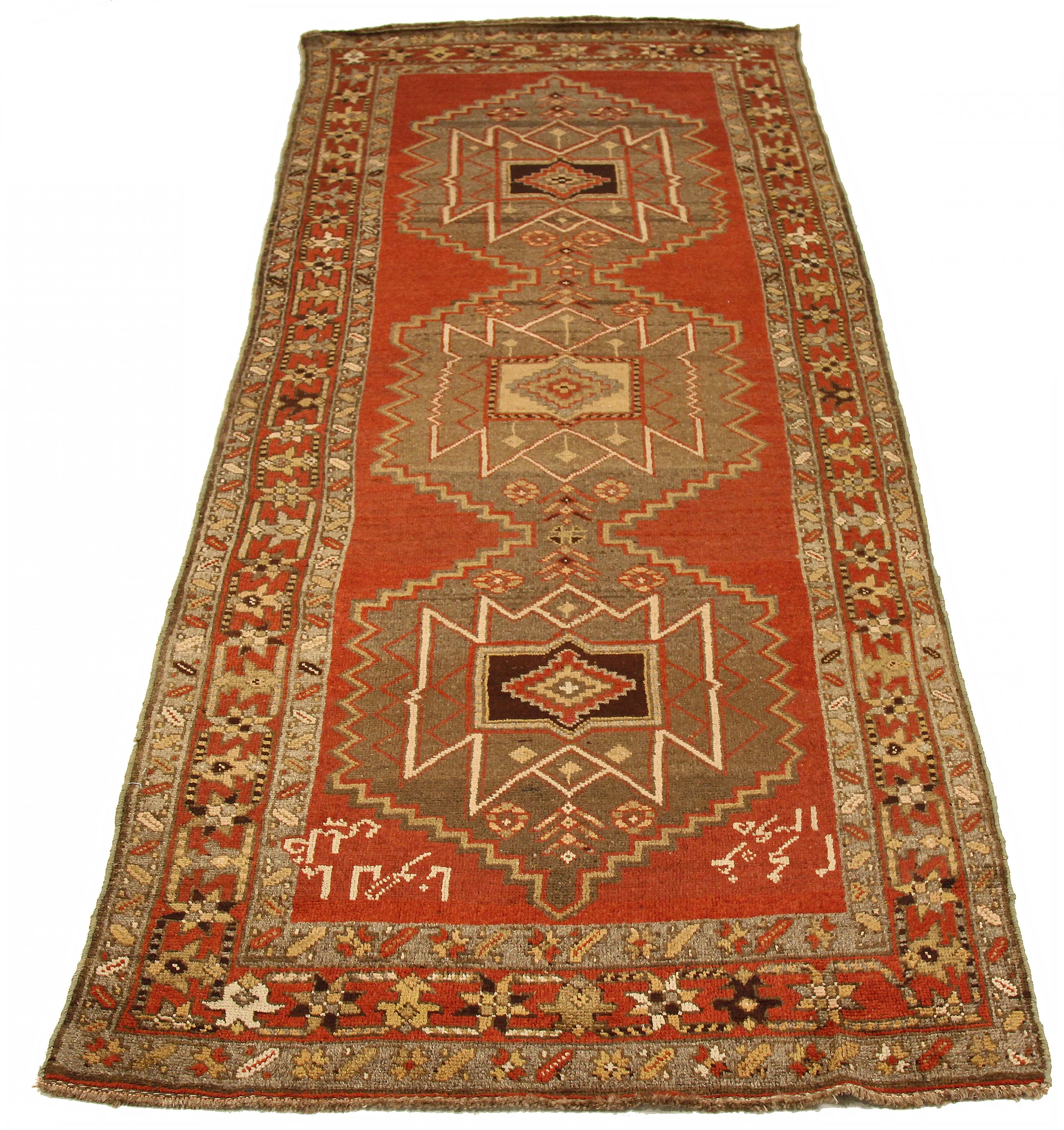 Antique Persian area rug handwoven from the finest sheep’s wool. It’s colored with all-natural vegetable dyes that are safe for humans and pets. It’s a traditional Azerbaijan design featuring tribal details on a red field. It’s a lovely piece to