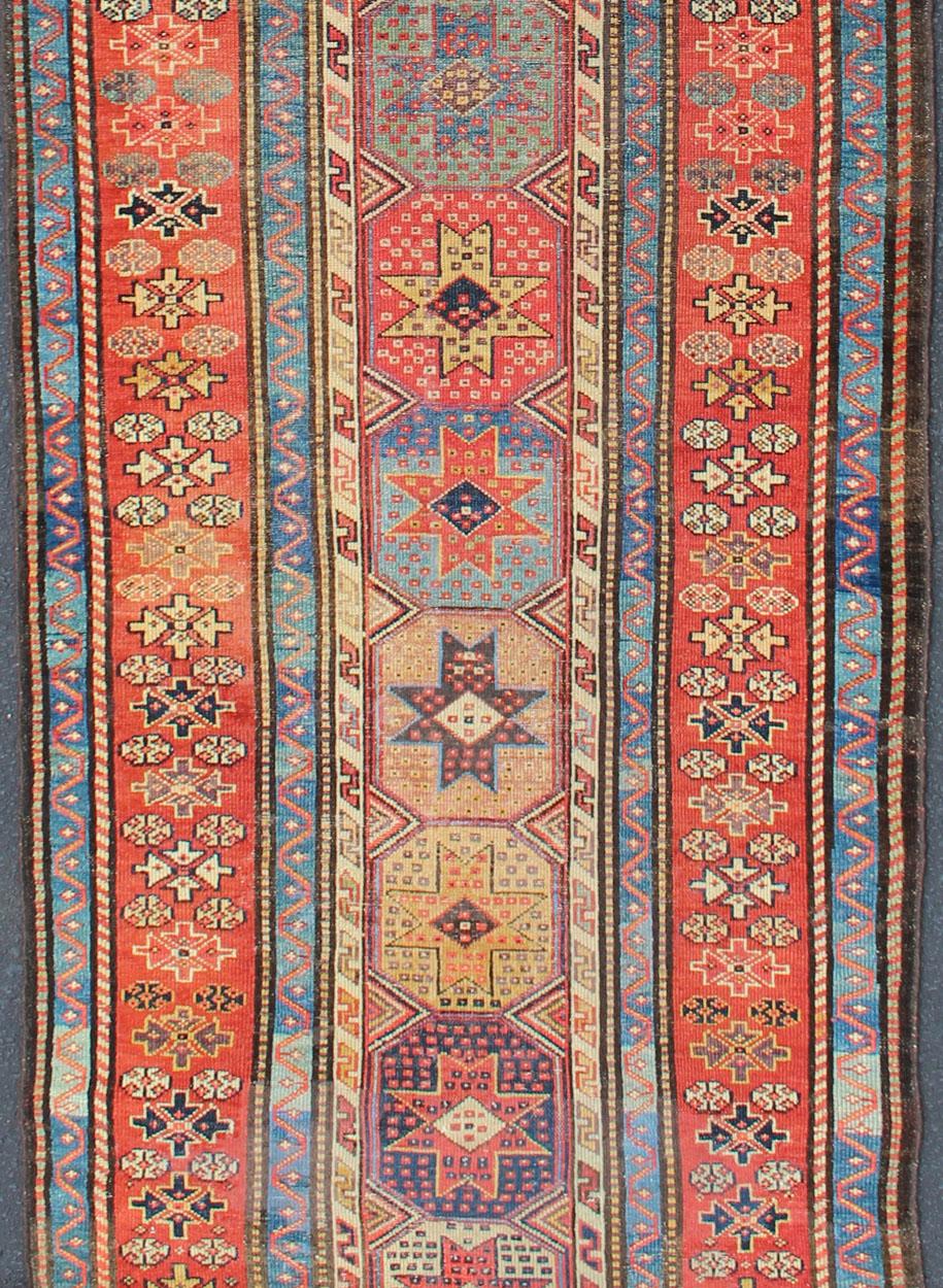 Tribal Antique Persian Kazak Runner with Medallions in Red, Blue, and Yellow For Sale