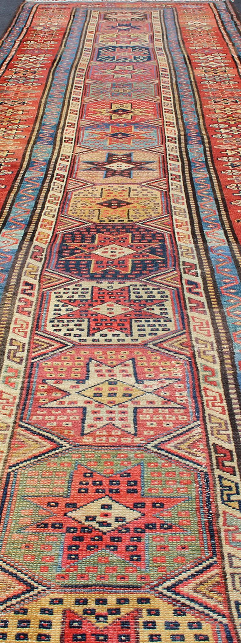 Antique Persian Kazak Runner with Medallions in Red, Blue, and Yellow In Good Condition For Sale In Atlanta, GA
