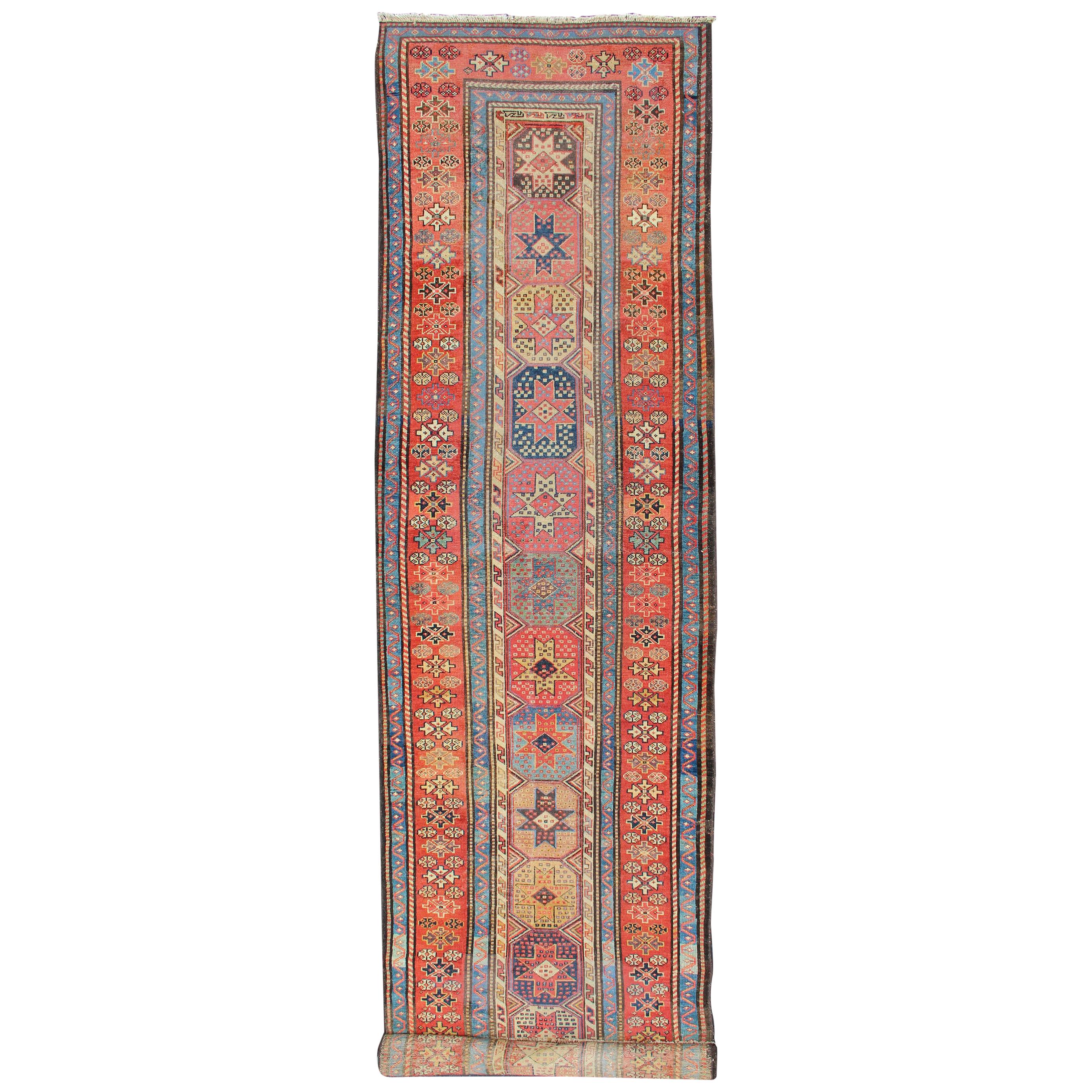 Antique Persian Kazak Runner with Medallions in Red, Blue, and Yellow For Sale