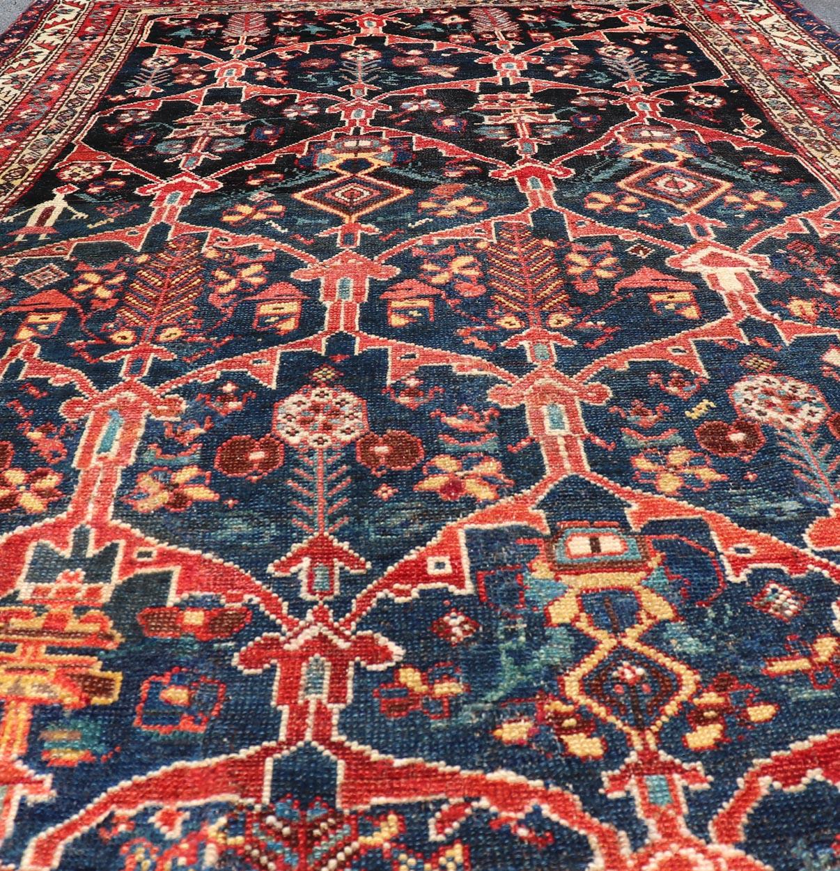 Antique Persian Bakhitari Colorful Rug with All-Over Floral Medallion Design. Keivan Woven Arts: rug EMB-9695-13820; Antique Persian Rug, Antique Persian  Antique Persian Floral Rug, Antique Bakhtiari. 
Measures: 4'8 x 8'4 
This woven art features a