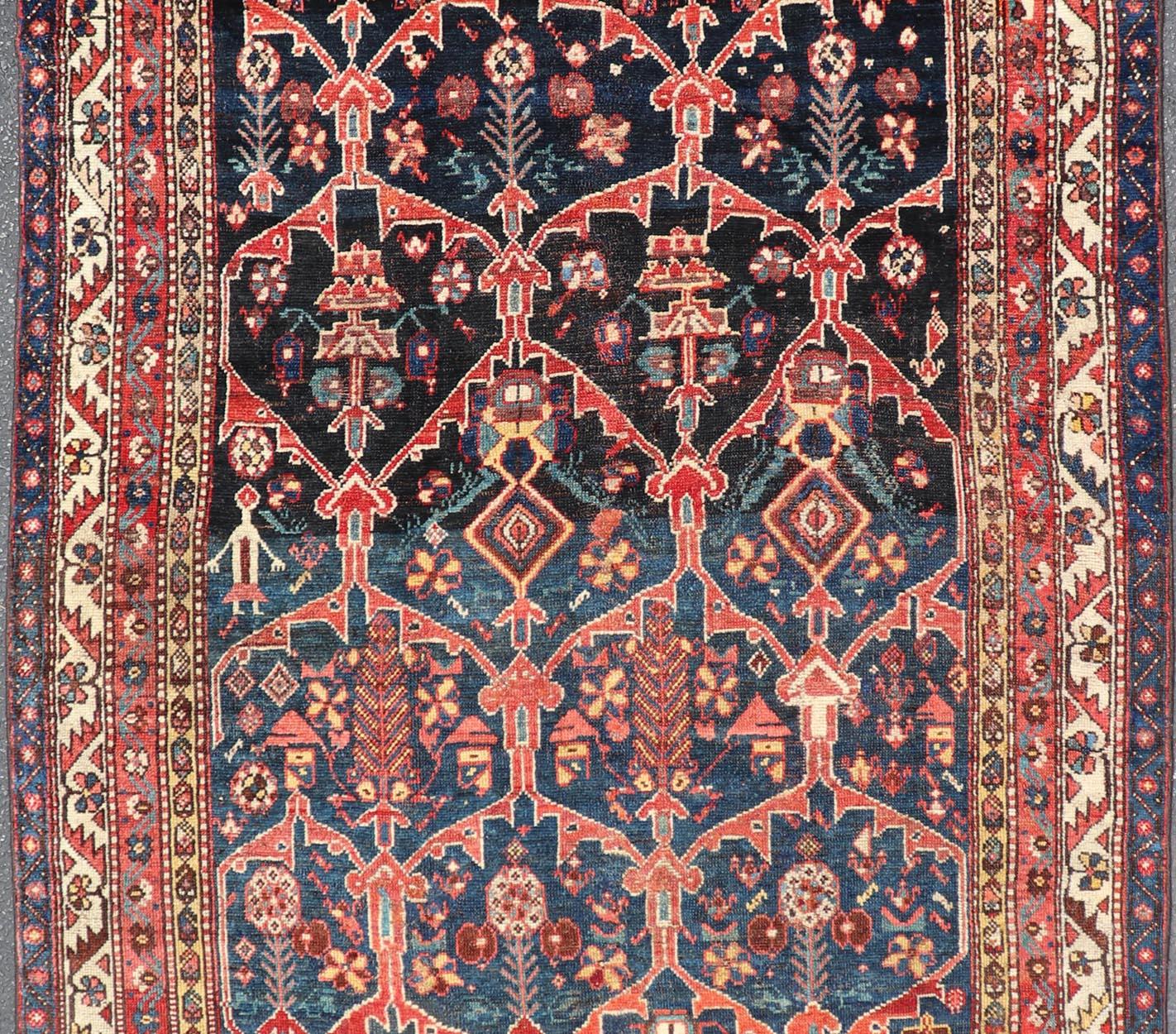Antique Persian Bakhitari Colorful Rug with All-Over Floral Medallion Design  For Sale 1