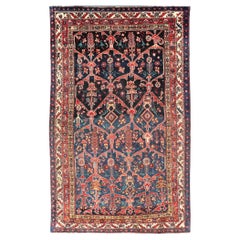 Tapis persan ancien coloré Bakhitari avec motif de médaillons à fleurs sur toute sa surface 