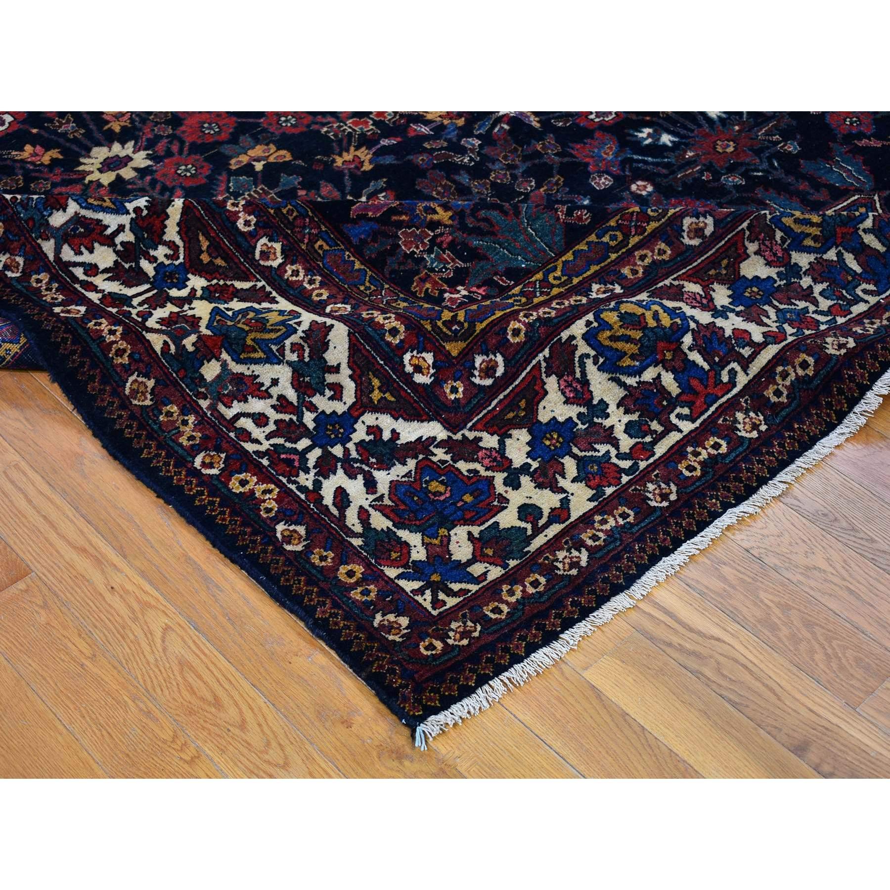 Early 20th Century Antique Persian Bakhtiar Good Condition Longer Shape Worn Down Hand Knotted Rug For Sale