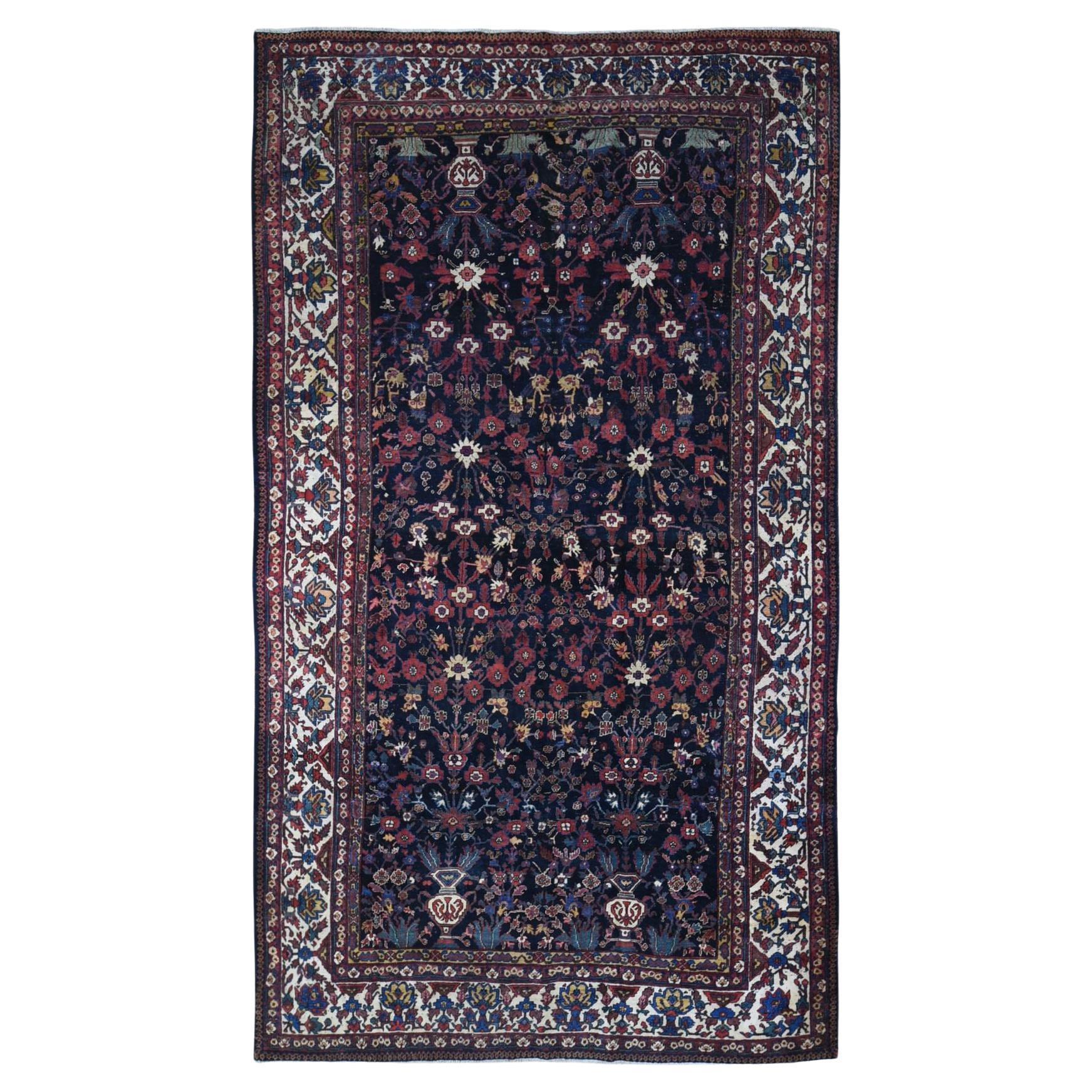 Antique Persian Bakhtiar Good Condition Longer Shape Worn Down Hand Knotted Rug For Sale