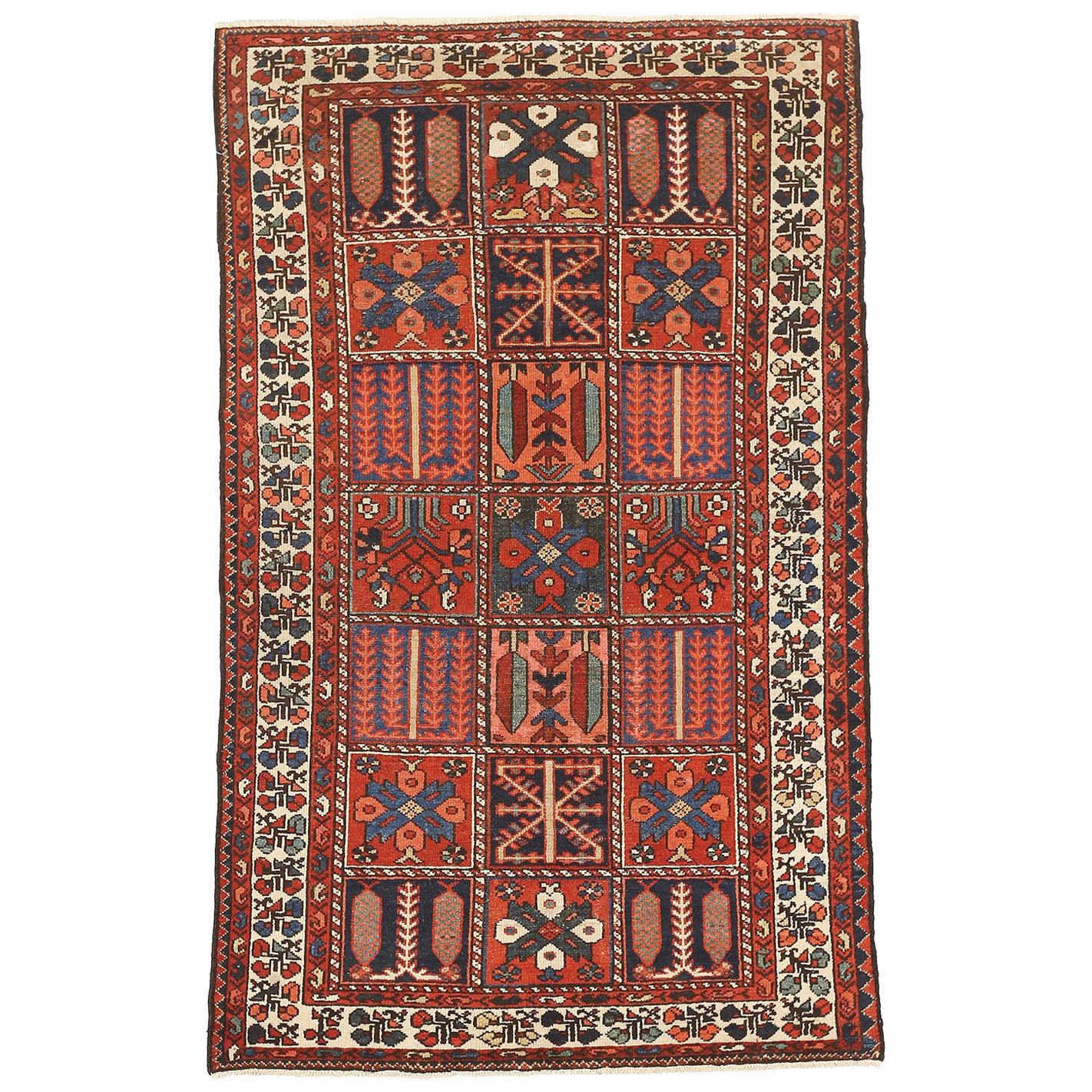 Antique Persian Bakhtiar Rug with Blue and Red Tribal Details on Ivory Field For Sale