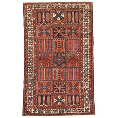 Vintage Persian Bakhtiar Rug with Blue and Red Tribal Details on Ivory Field