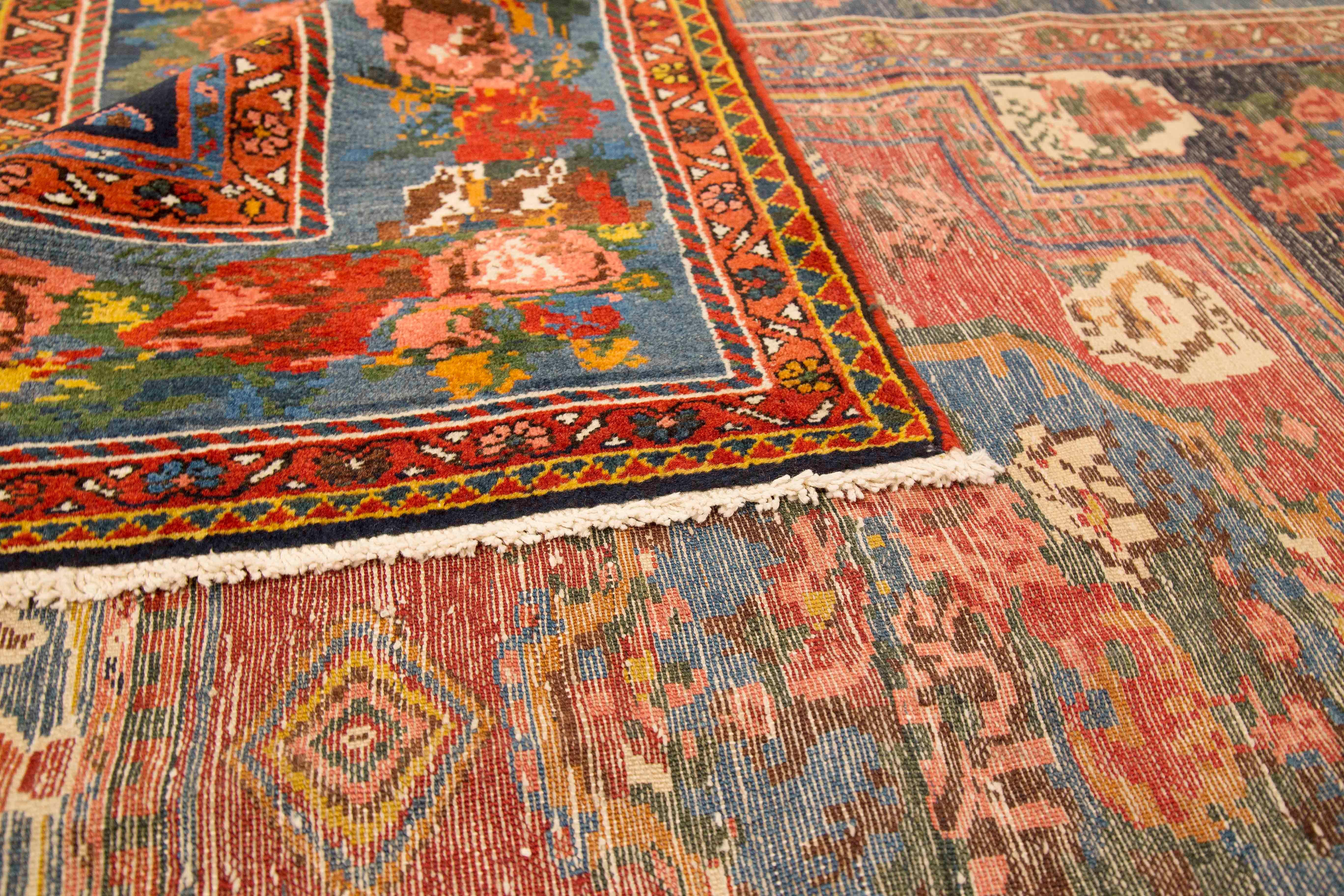 Hand-Woven Antique Persian Bakhtiar Rug with Blue and Red Floral Medallions For Sale