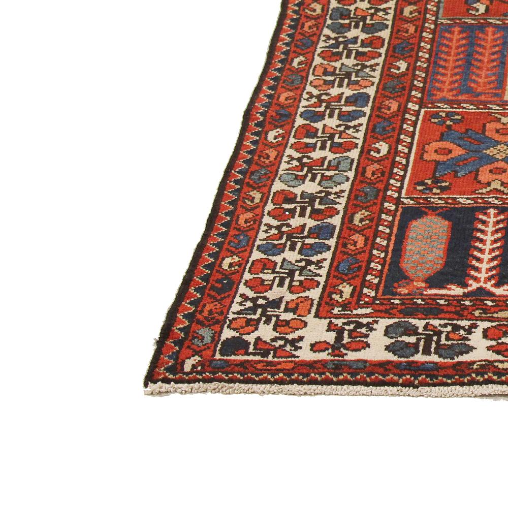 Hand-Woven Antique Persian Bakhtiar Rug with Blue and Red Tribal Details on Ivory Field For Sale