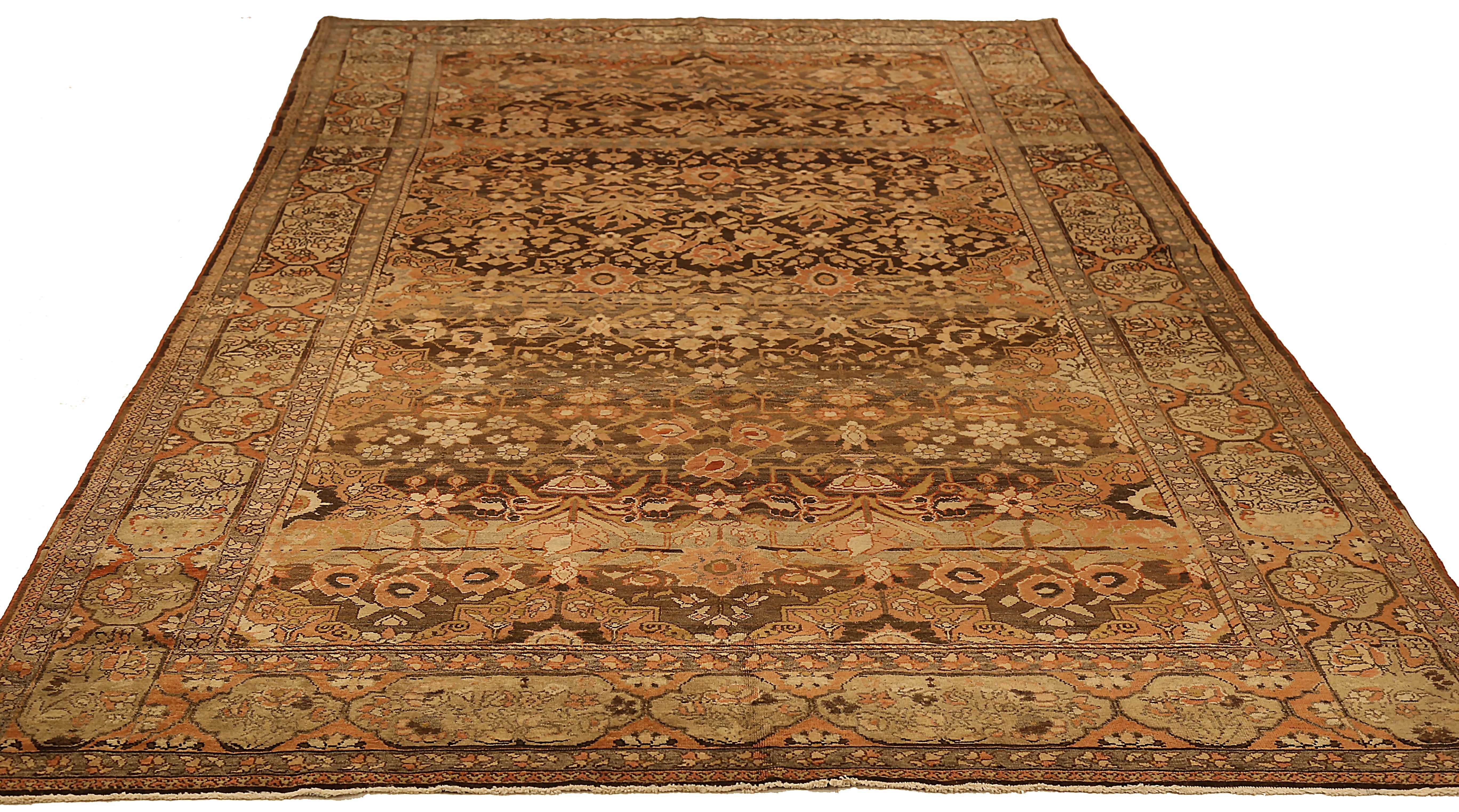 Antique Persian rug handwoven from the finest sheep’s wool and colored with all-natural vegetable dyes that are safe for humans and pets. It’s a traditional Bakhtiar design highlighted by floral details all-over a deep brown field. It’s a beautiful