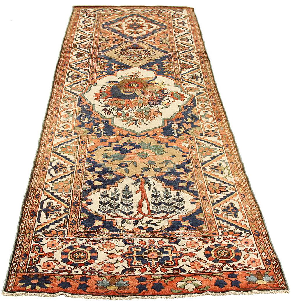 Antique Persian rug handwoven from the finest sheep’s wool and colored with all-natural vegetable dyes that are safe for humans and pets. It’s a traditional Bakhtiar design highlighted by flower portrait details over an ivory field. It’s a beautiful