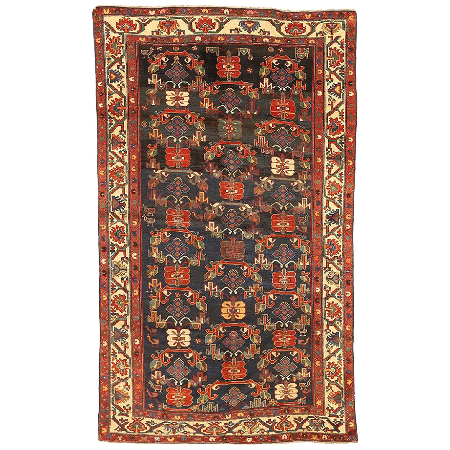 Antique Persian Bakhtiar Rug with Green and Red Flower Details on Black Field