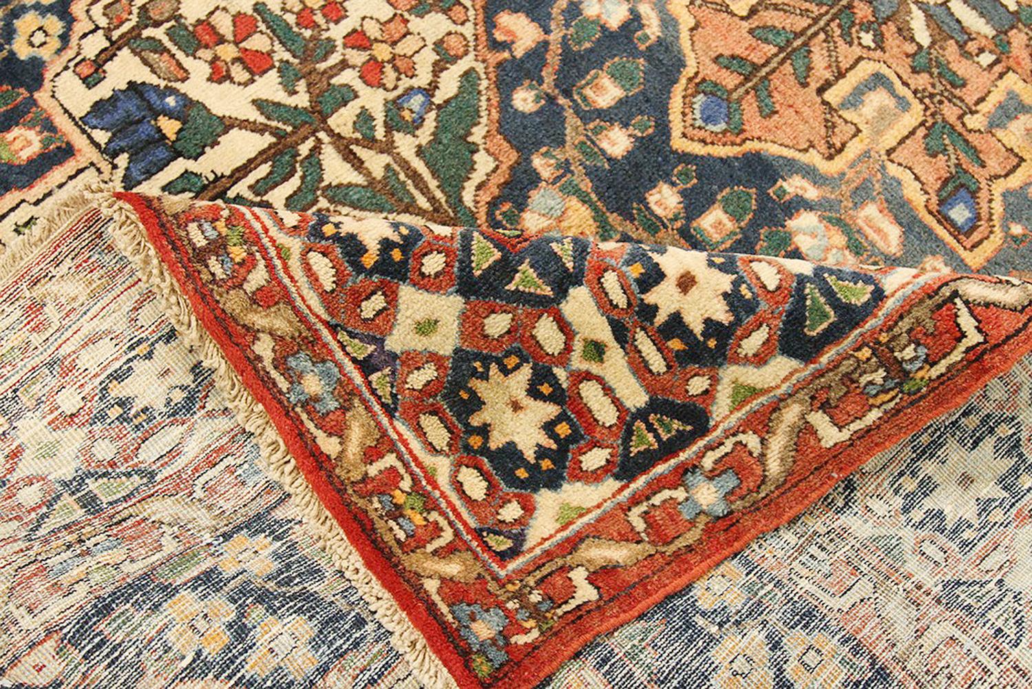 Islamic Antique Persian Bakhtiar Rug with Green and Blue Floral Details on Ivory Field For Sale