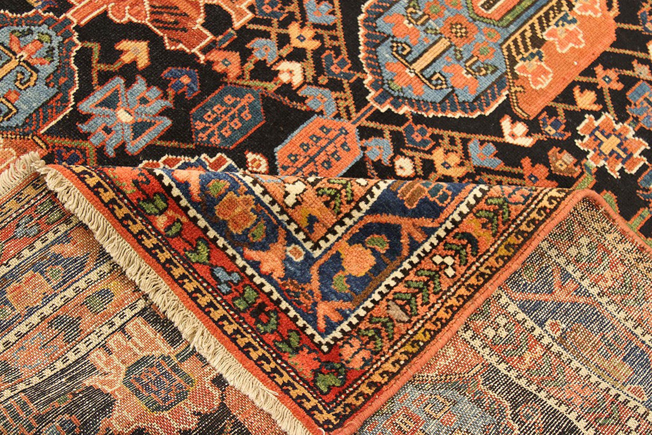 Antique Persian rug handwoven from the finest sheep’s wool and colored with all-natural vegetable dyes that are safe for humans and pets. It’s a traditional Bakhtiar design highlighted by large blue and orange floral medallions in blue and orange