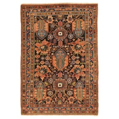 Antique Persian Bakhtiar Rug with Large Blue and Orange Floral Medallions