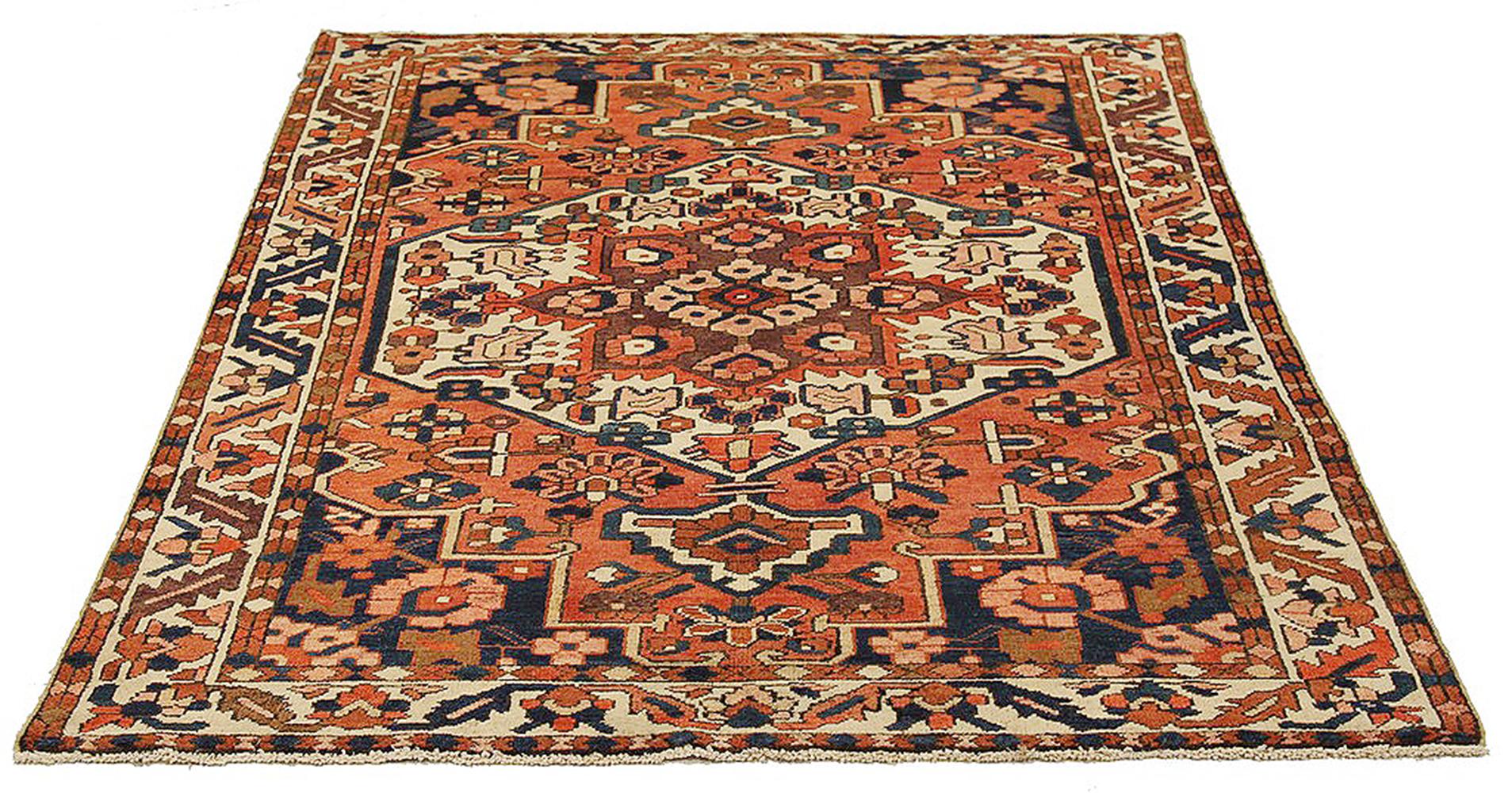 Antique Persian rug handwoven from the finest sheep’s wool and colored with all-natural vegetable dyes that are safe for humans and pets. It’s a traditional Bakhtiar design highlighted by flower portrait details over an ivory field. It’s a beautiful