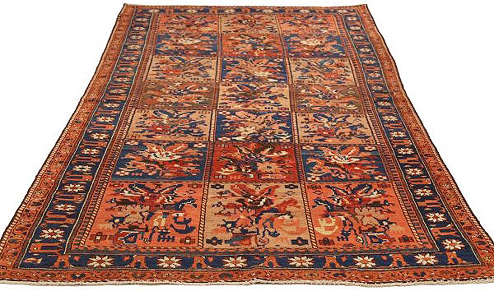 Antique Persian rug handwoven from the finest sheep’s wool and colored with all-natural vegetable dyes that are safe for humans and pets. It’s a traditional Bakhtiar design showing navy and red flower patterns over a beige field. It’s a beautiful