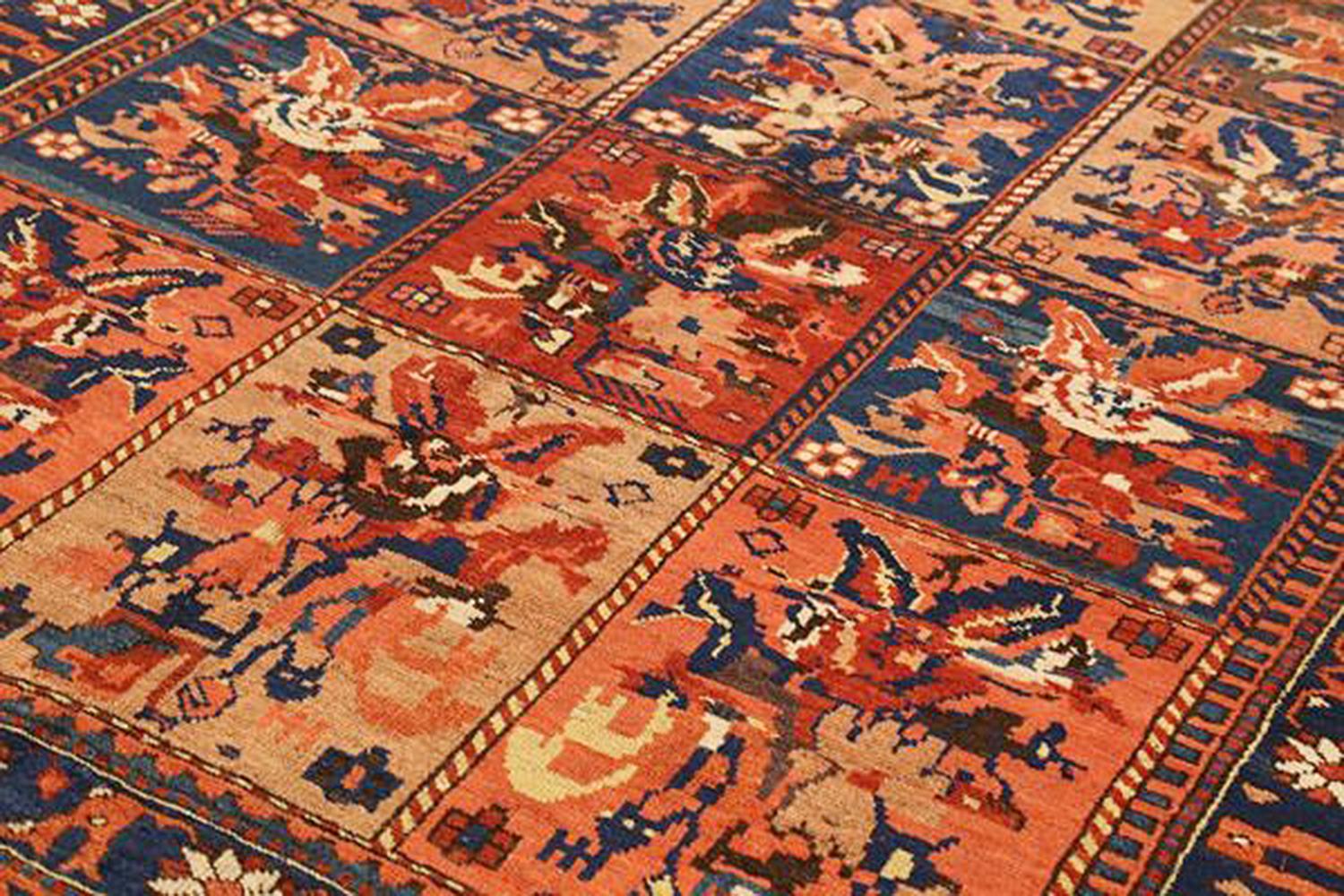 Islamic Antique Persian Bakhtiar Rug with Navy and Red Flower Details on Beige Field For Sale