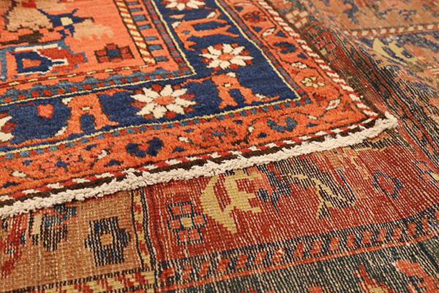 Hand-Woven Antique Persian Bakhtiar Rug with Navy and Red Flower Details on Beige Field For Sale