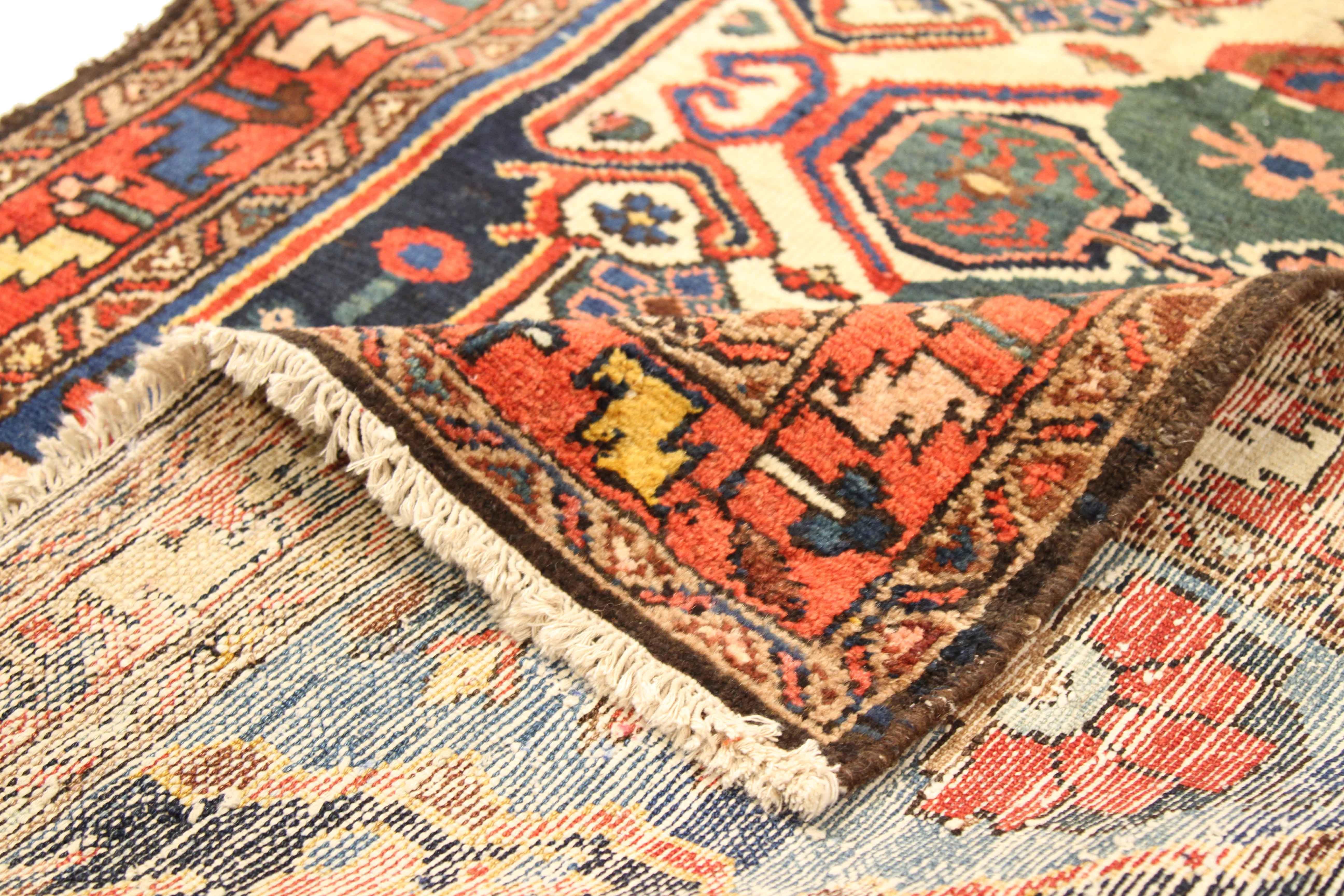 1950s Antique Persian Bakhtiar Runner Rug with Ivory & Red Geometric Medallions  In Excellent Condition For Sale In Dallas, TX