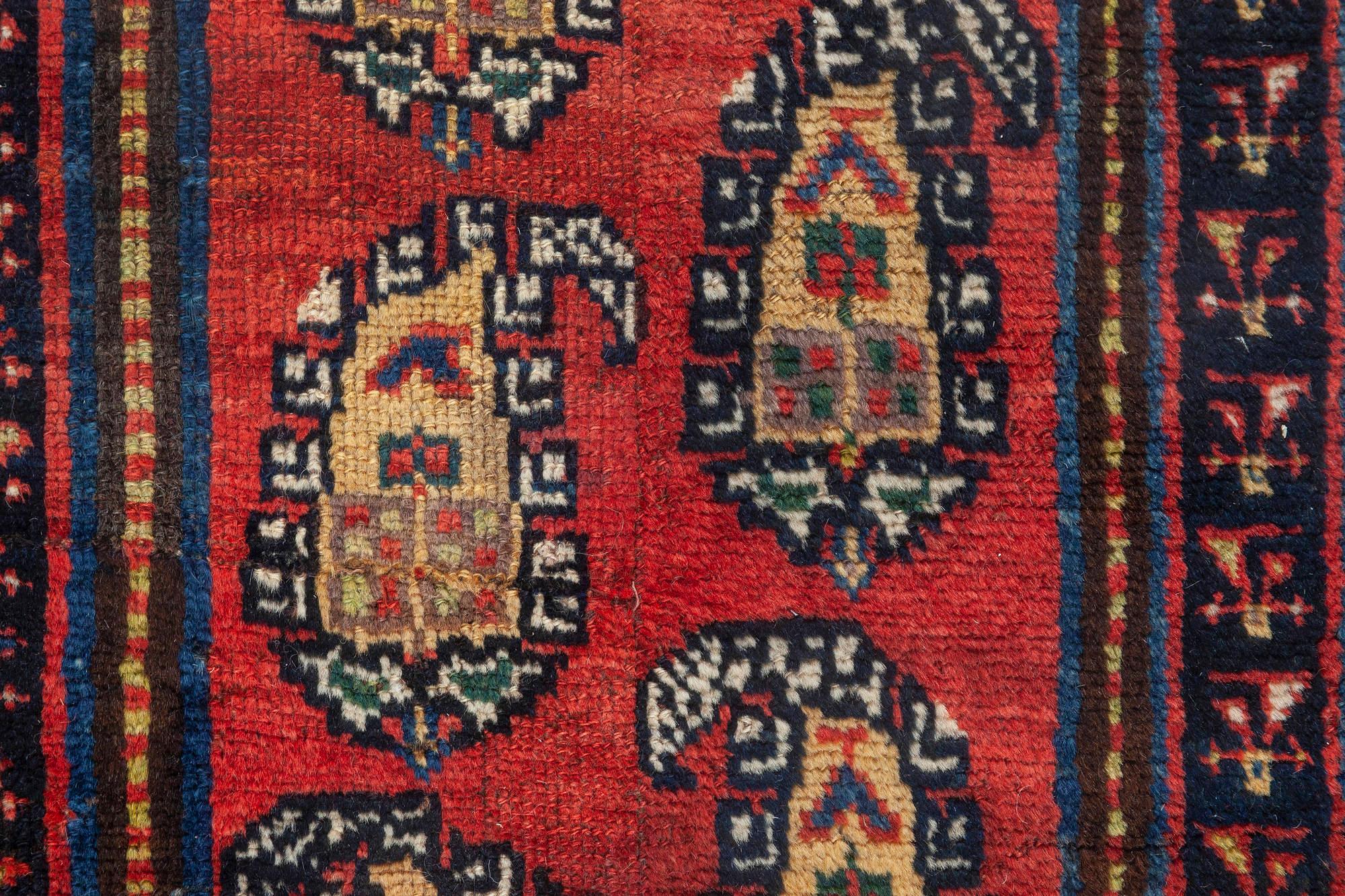 Antique Persian Bakhtiari blue, red and yellow runner fragment rug
Size: 1'9