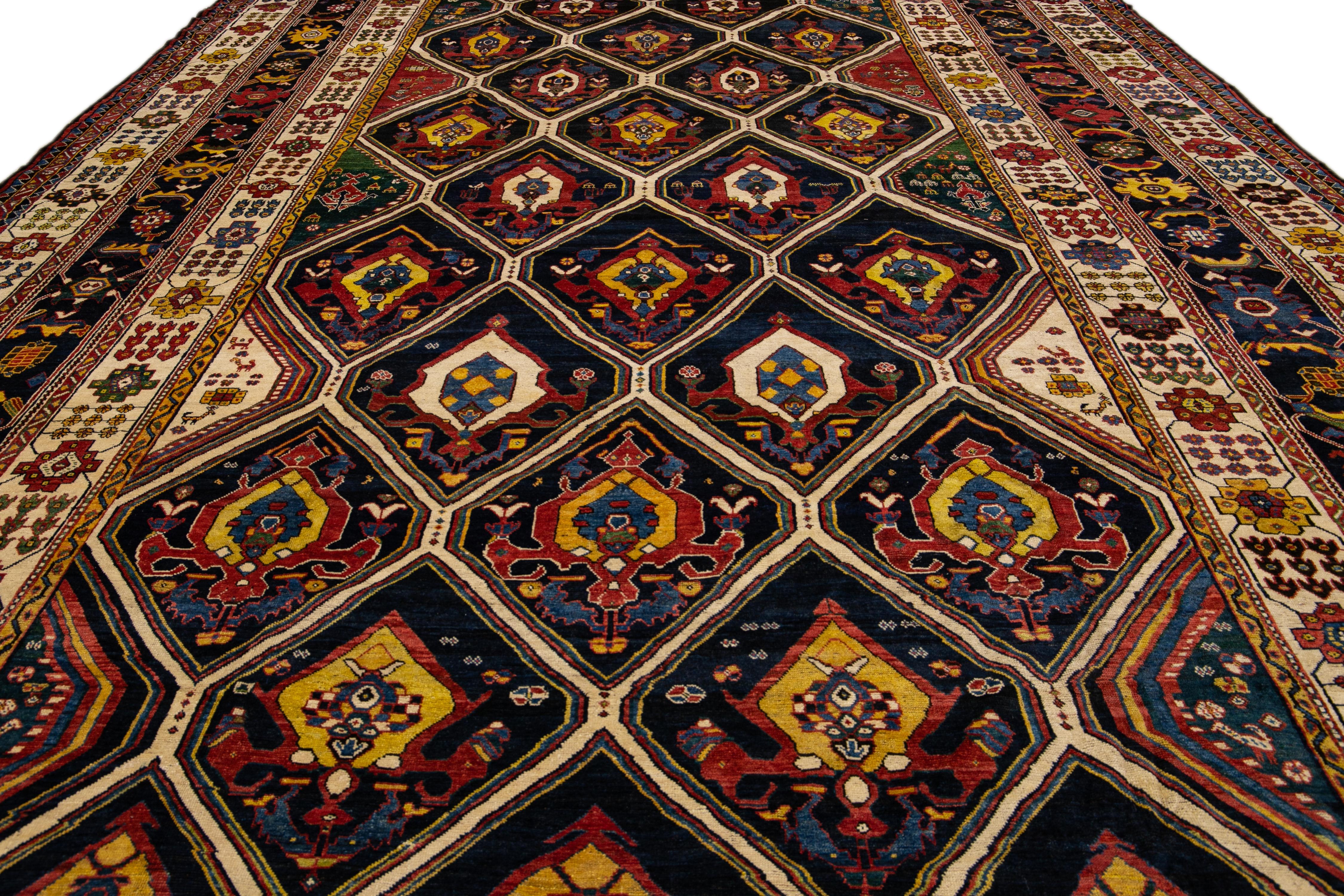 Islamic Antique Persian Bakhtiari Handmade Allover Designed Multicolor Oversize Wool Rug For Sale