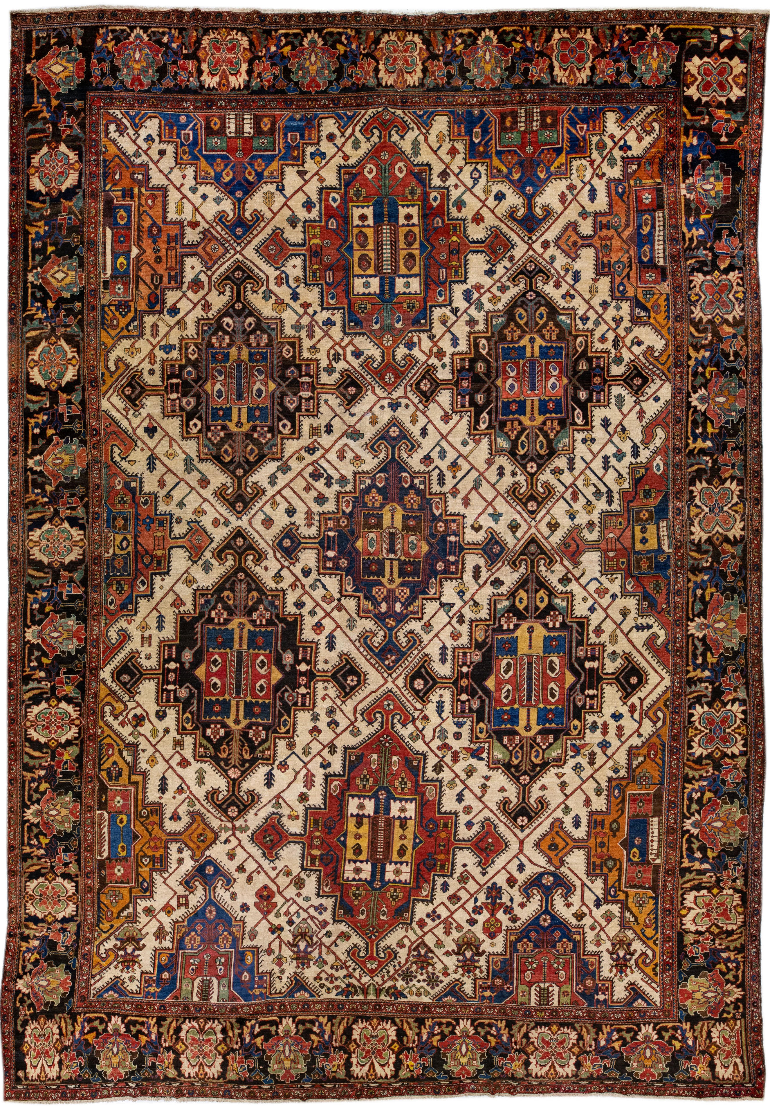 Antique Persian Bakhtiari Handmade Multicolor Geometric Wool Rug For Sale