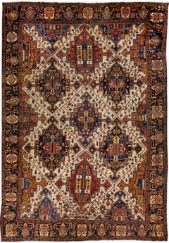 Tapis persan ancien Bakhtiari en laine géométrique multicolore fait à la main
