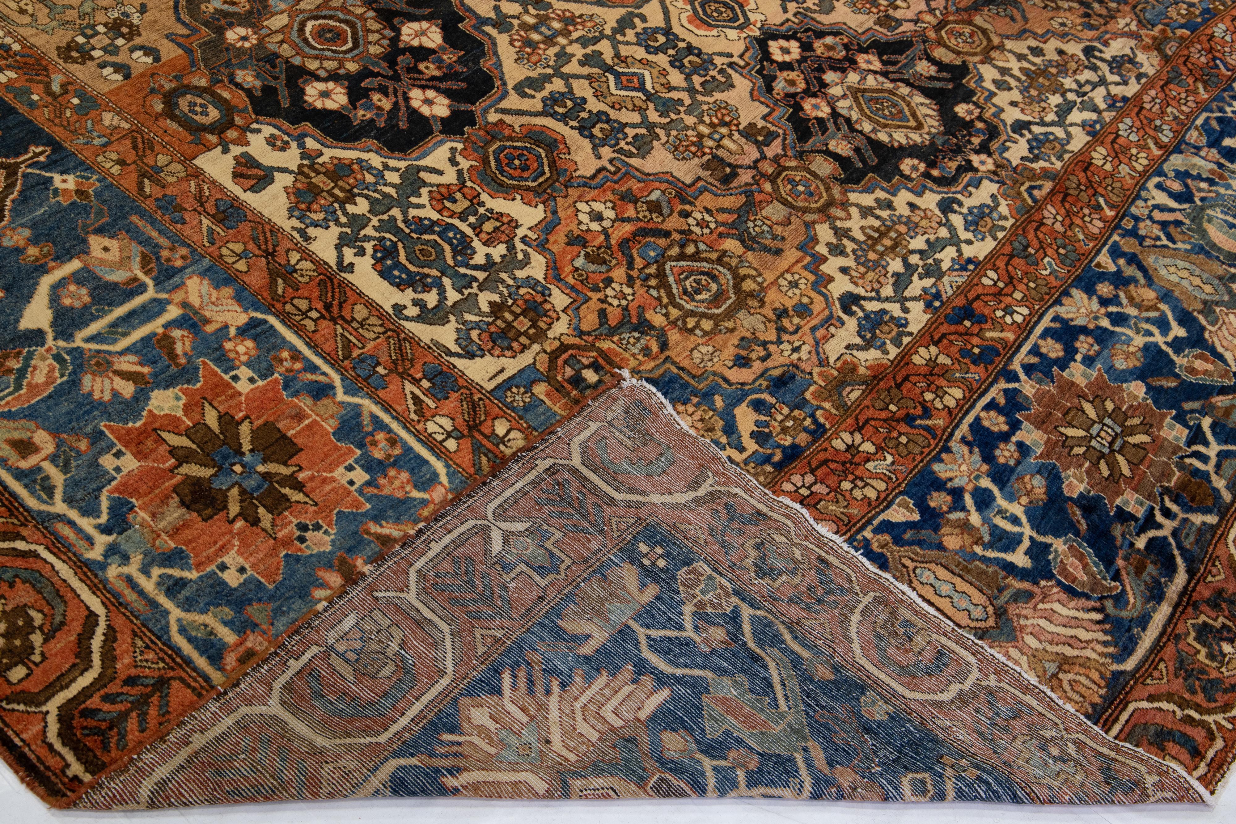 Beautiful antique Bakhtiari hand-knotted wool rug with a brown field. This piece has a blue frame with multicolor accent colors in a gorgeous all-over classic geometric design.

This rug measures 12'7